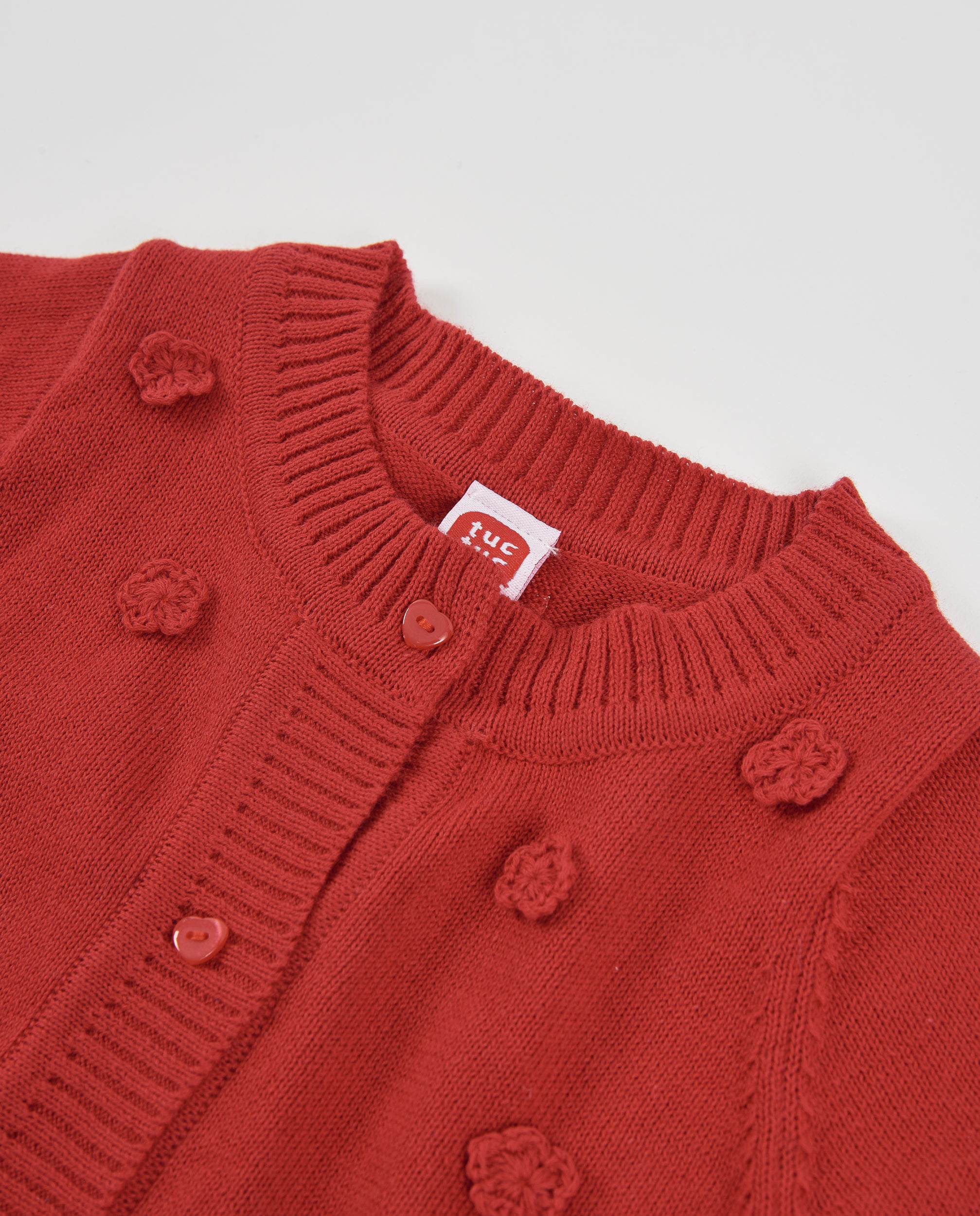 Chaqueta de tricot de bebé con flores en relieve