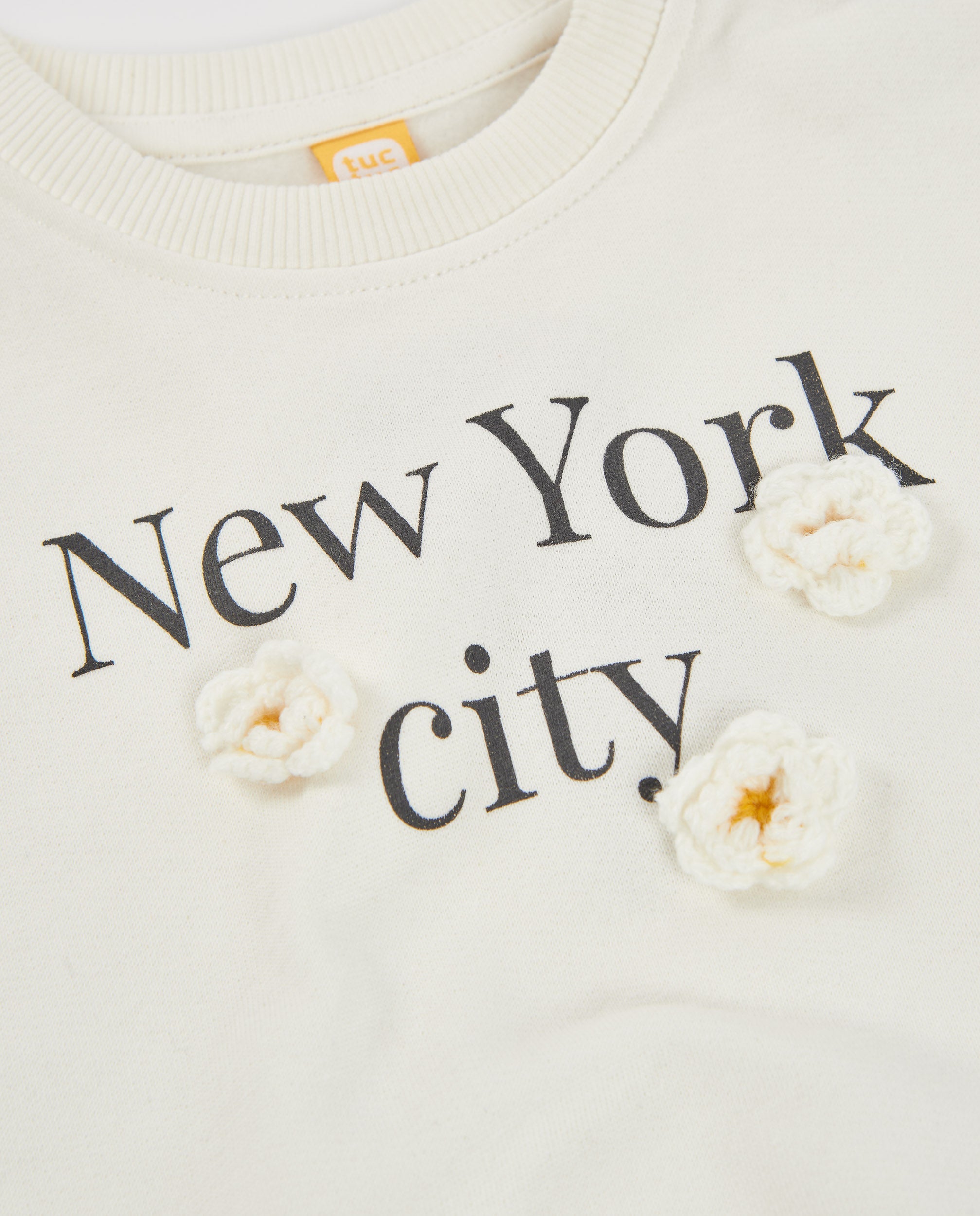 Sudadera de niña de felpa con estampado floral y mensaje frontal