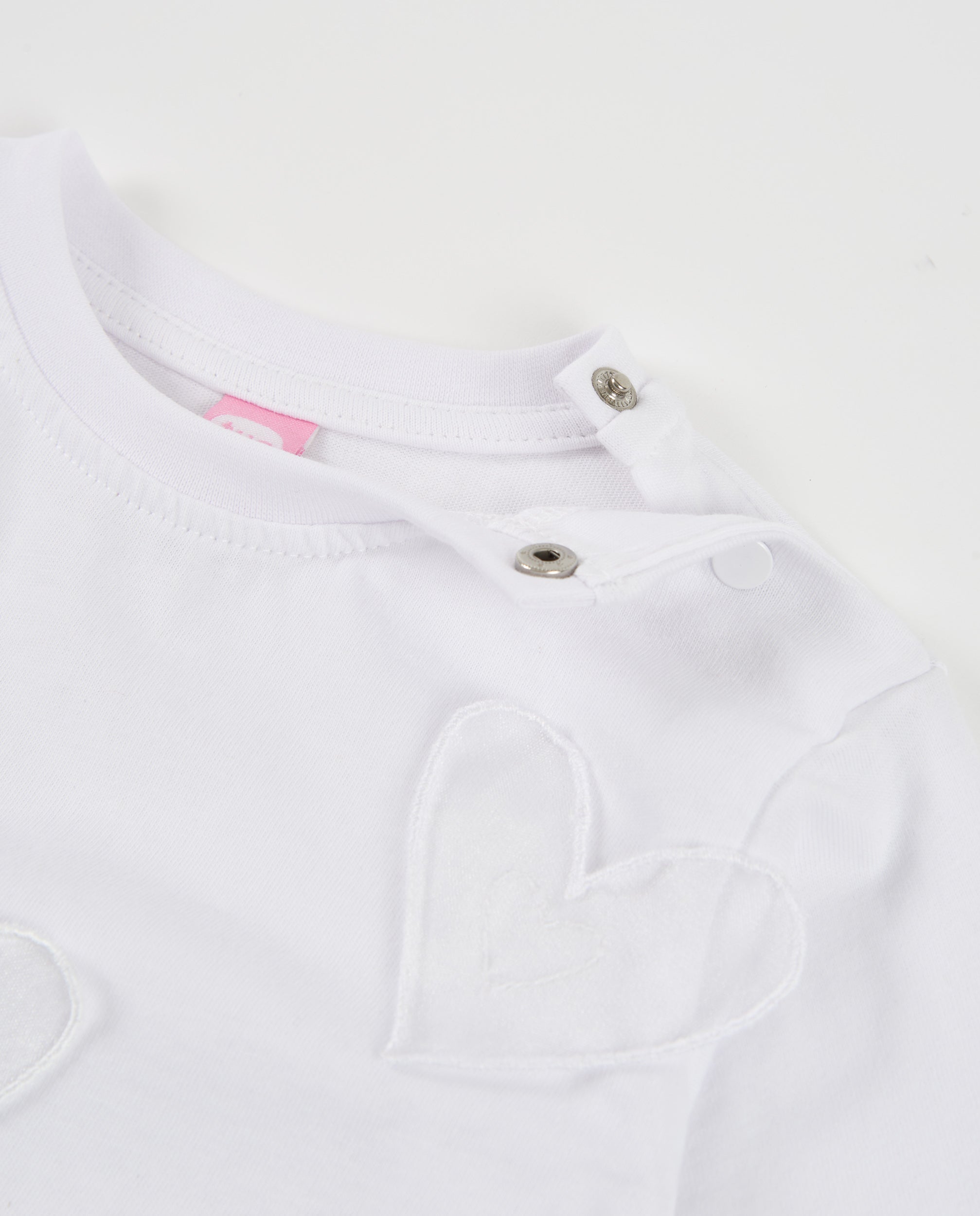 Camiseta de niña de punto con corazones bordados y manga larga