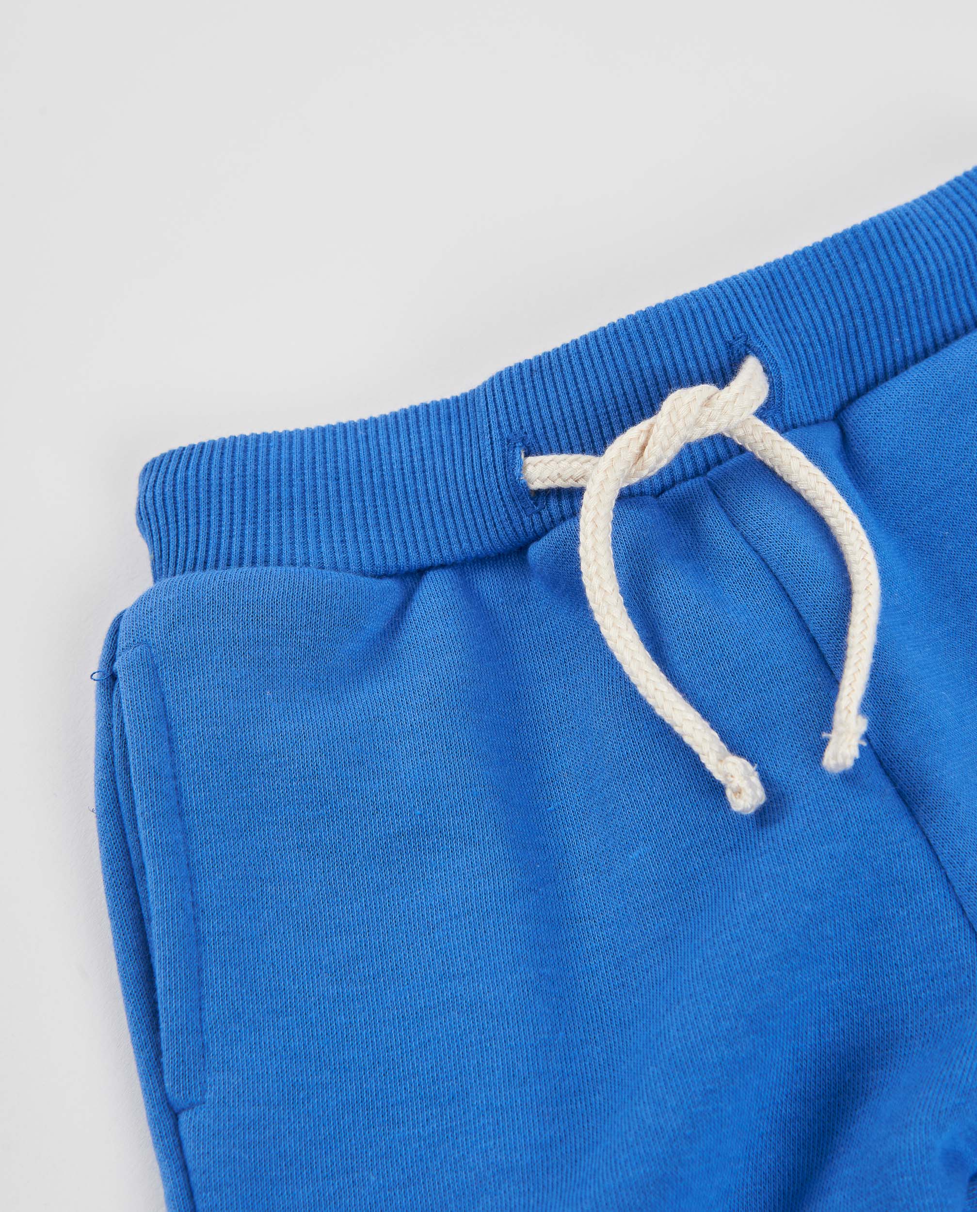 Pantalón de niño de felpa con bolsillo estampado