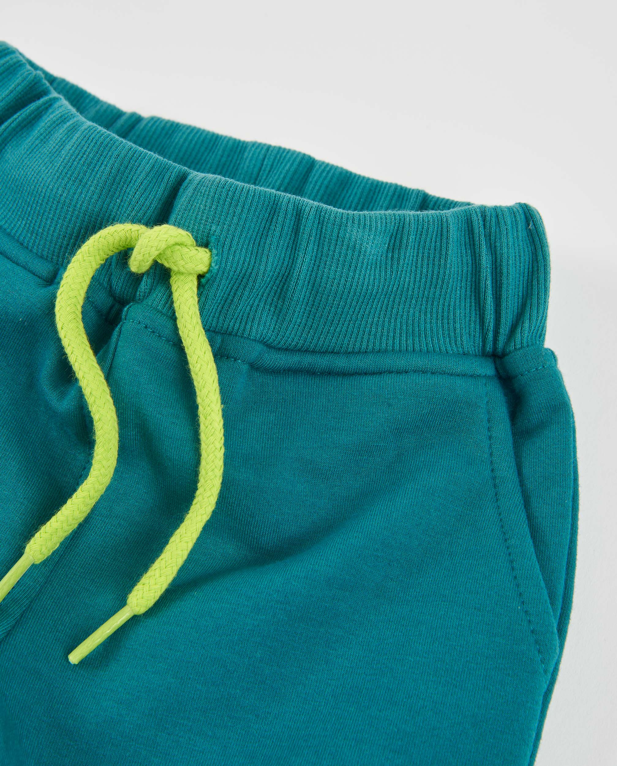 Pantalón de niño de felpa con bolsillo de parche