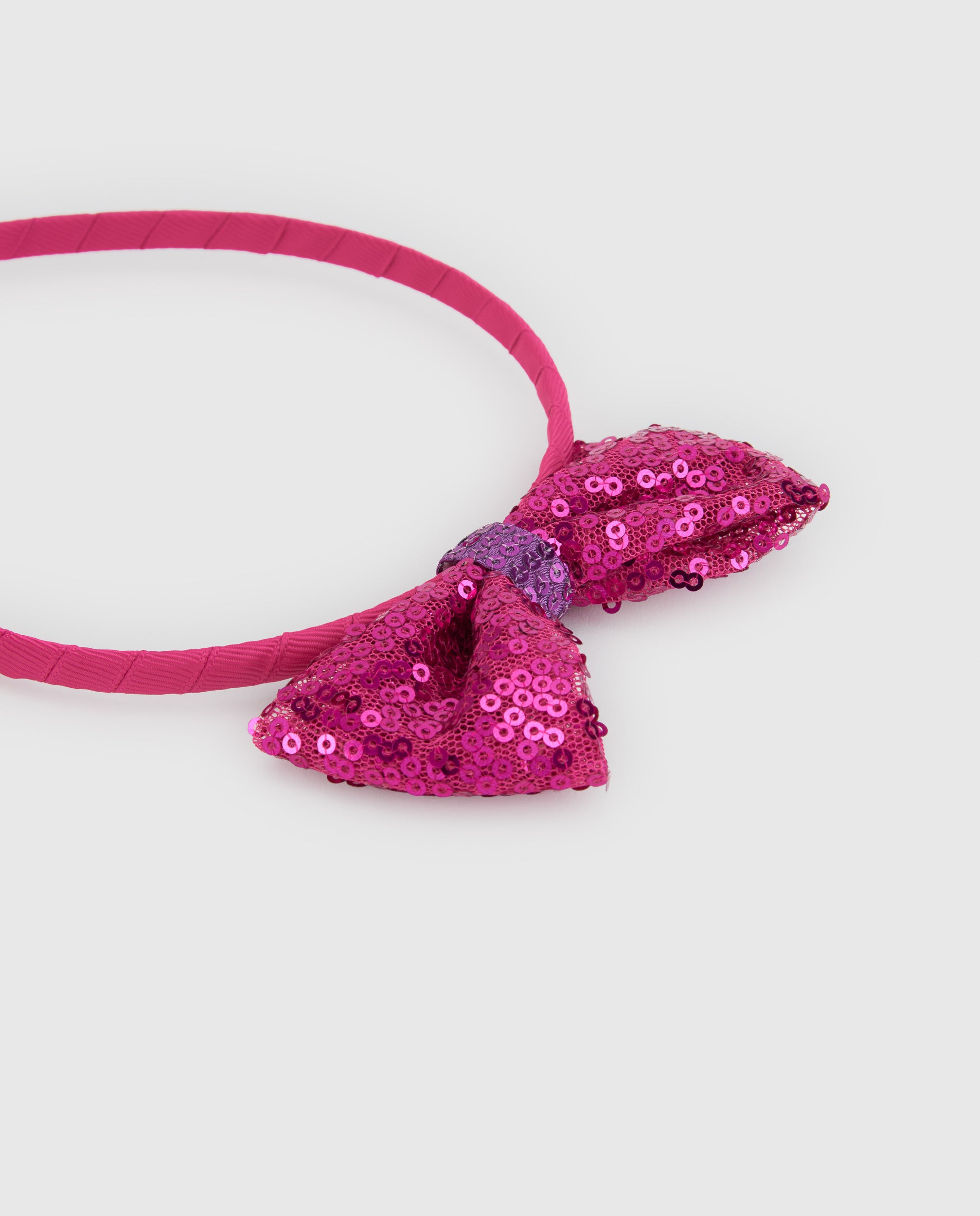Diadema de niña con lazo de lentejuelas y diseño rígido