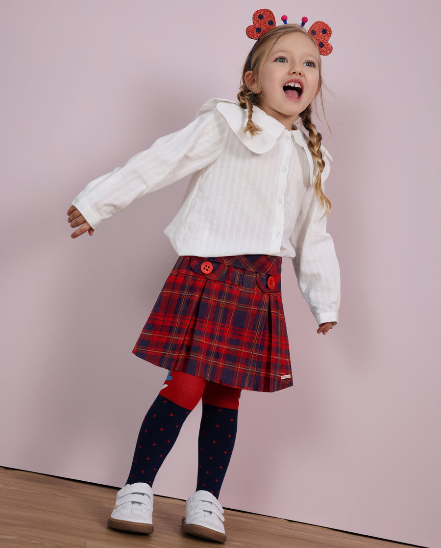 Girl's woven skirt with check pattern and decorative buttons
