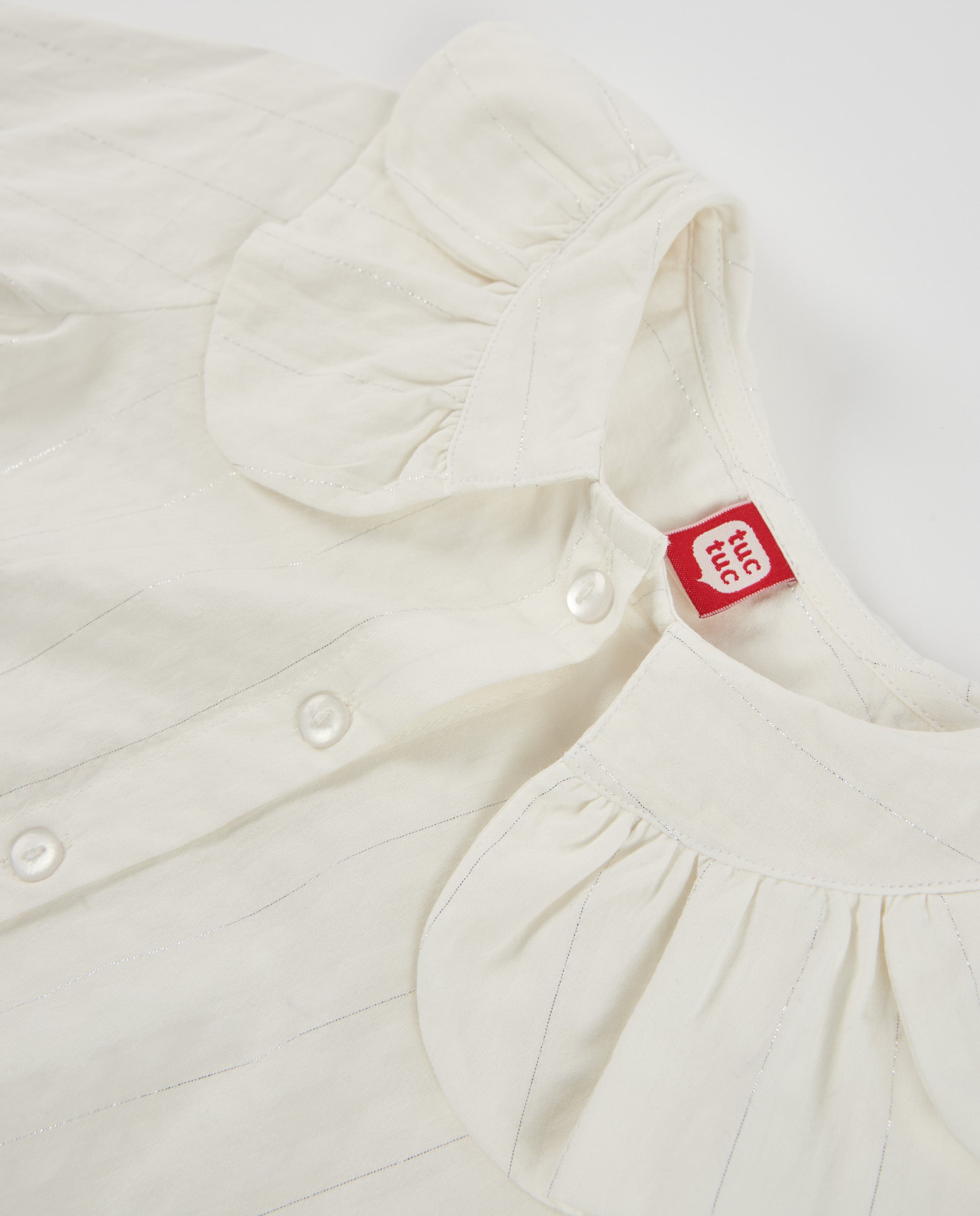 Blusa de niña de tela plana con cuello Peter Pan y botones