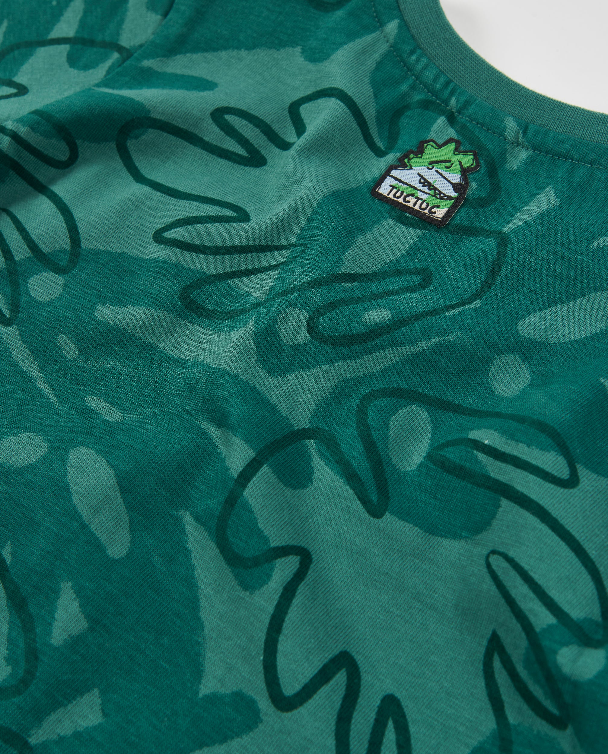 Camiseta de niño de punto con diseño de selva y bolsillo