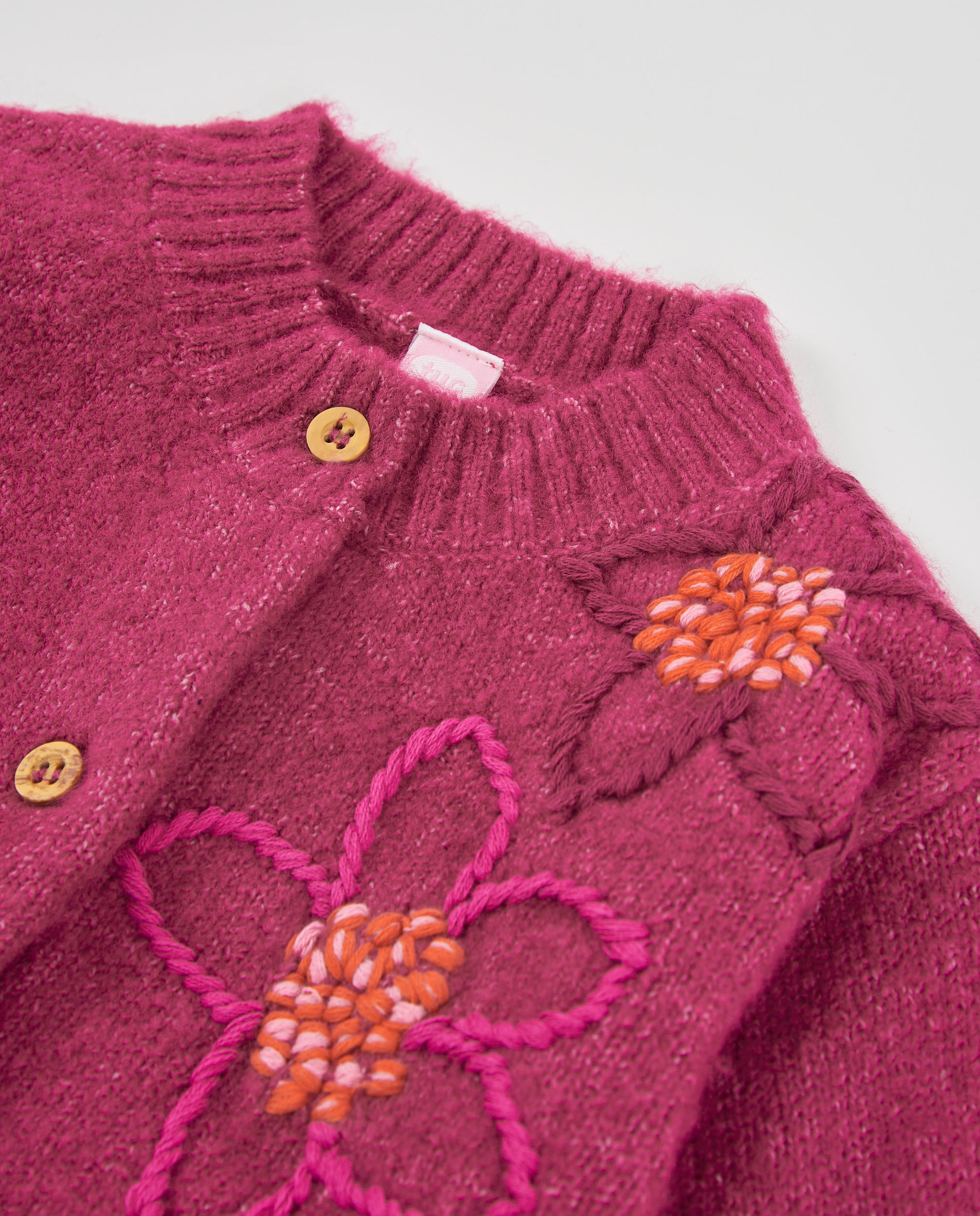 Chaqueta de niña de tricot con bordado floral y diseño envolvente