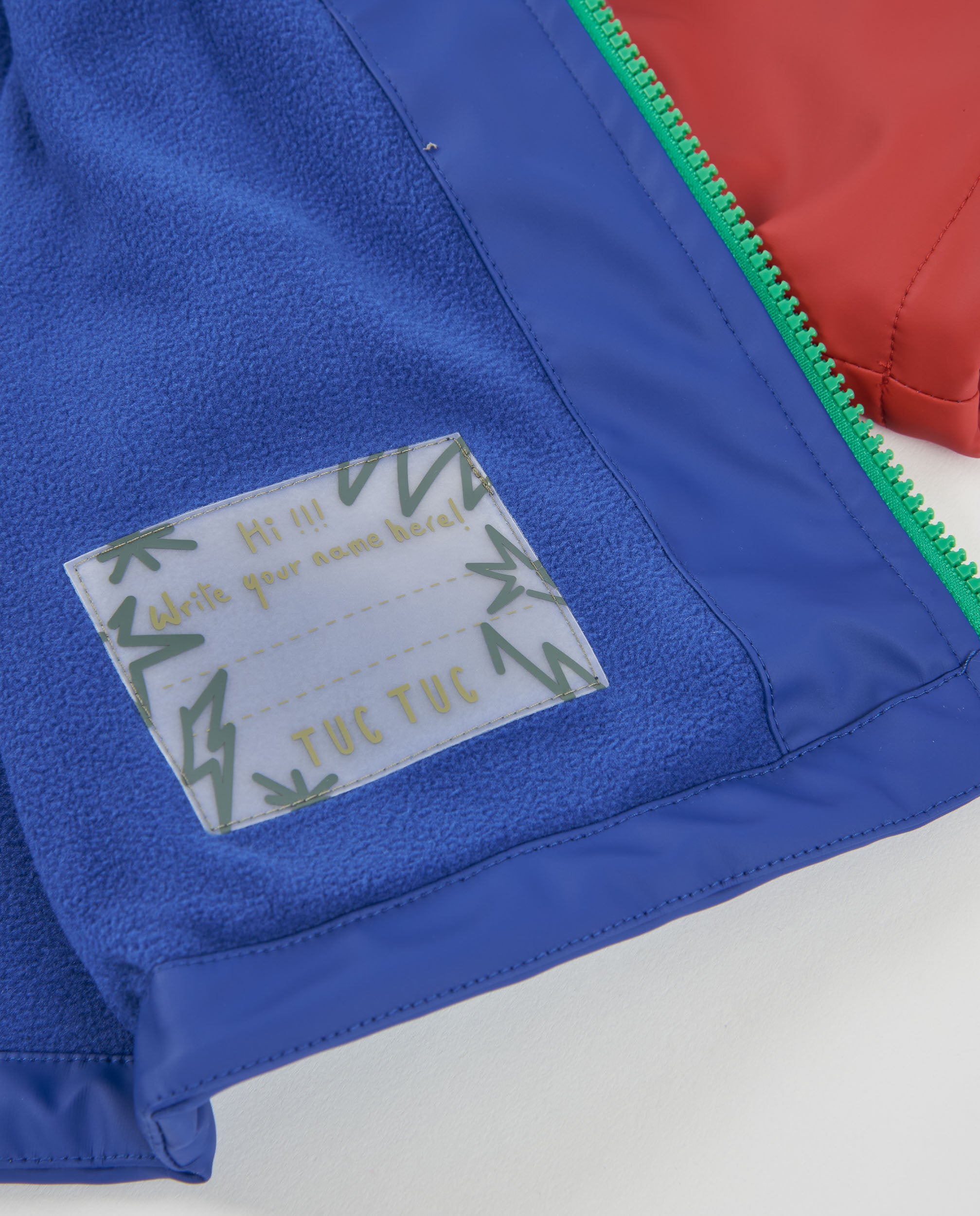 Chubasquero de niño con capucha y estampado de dinosaurio