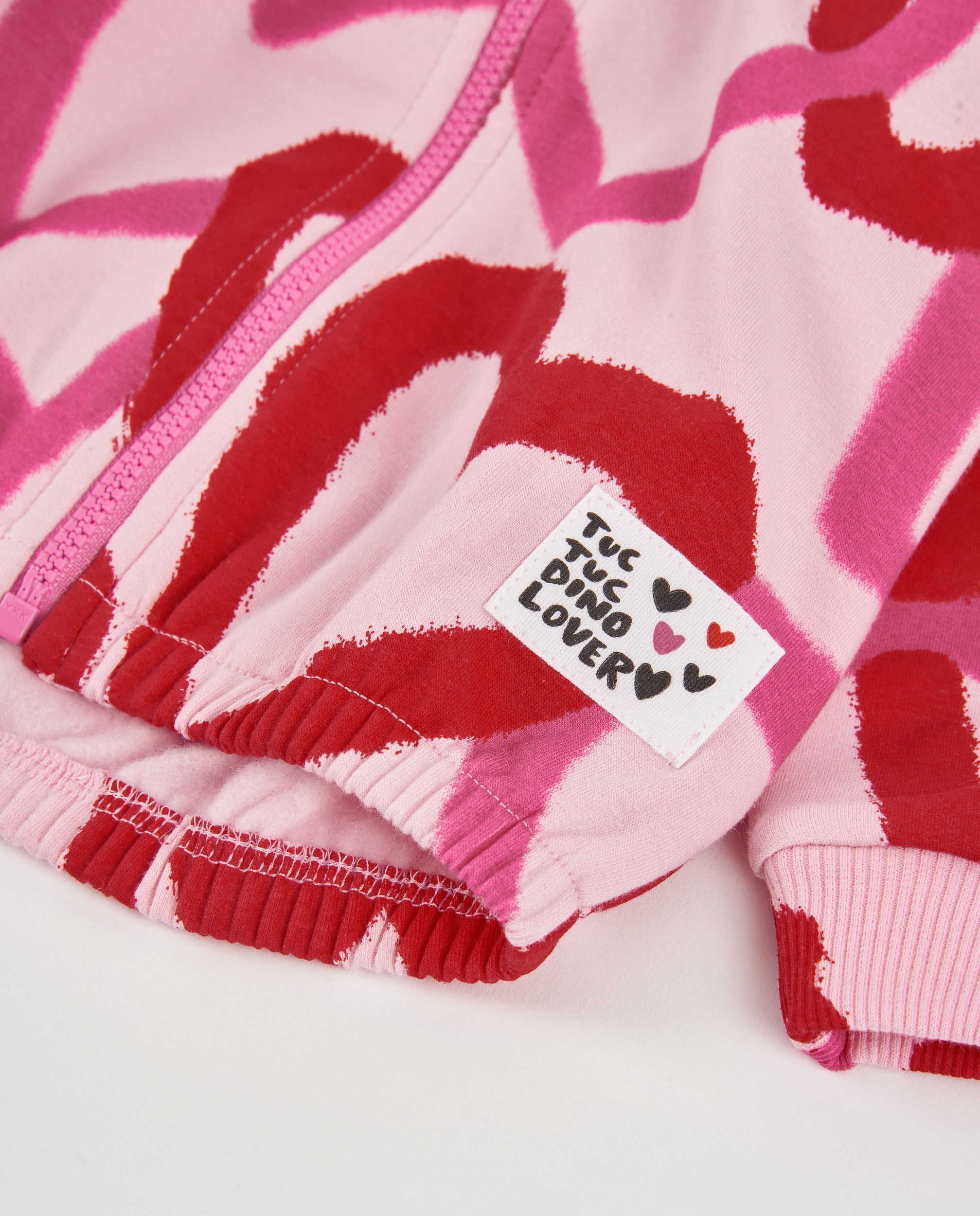 Sudadera de niña de felpa con cremallera y estampado de corazones