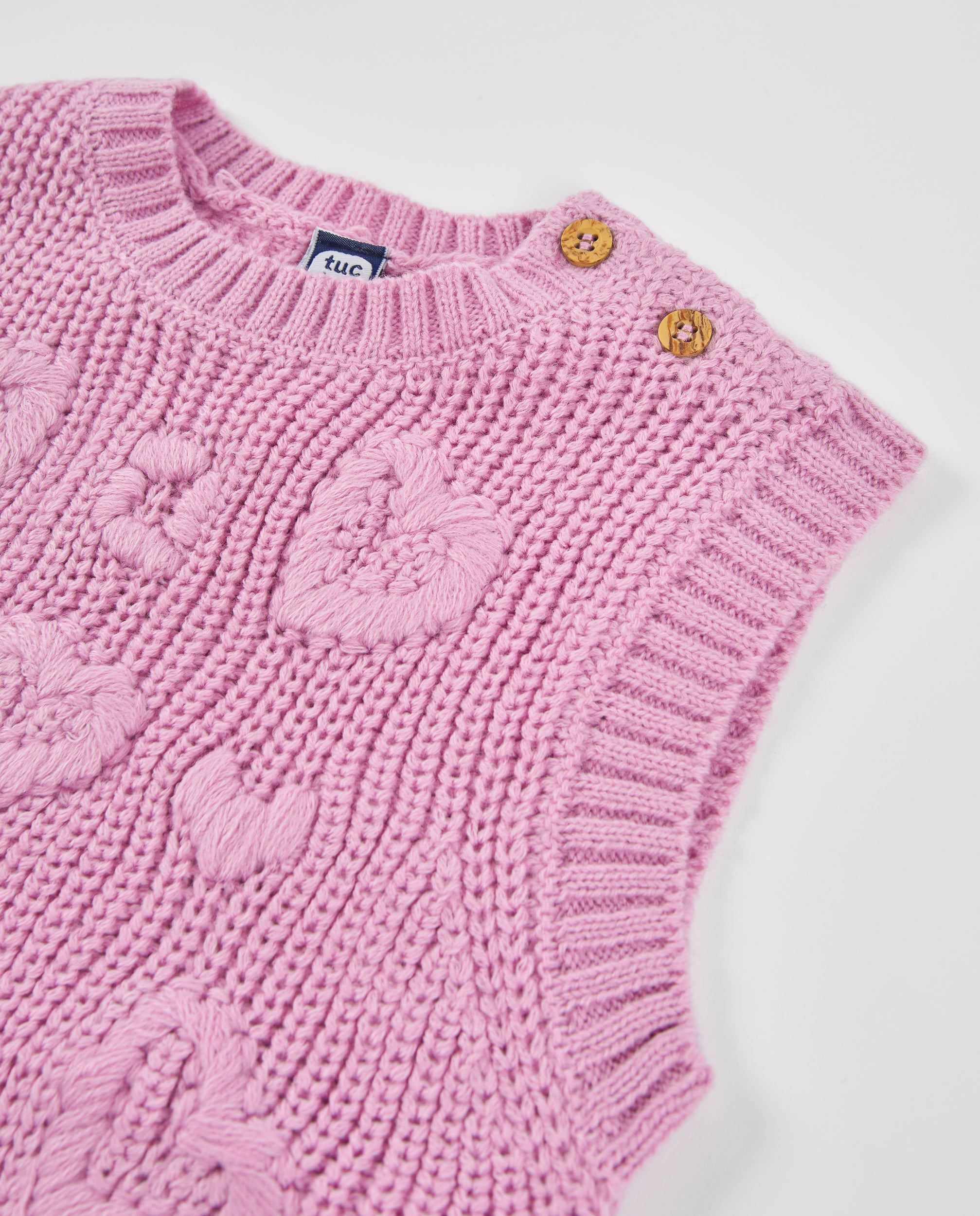 Chaleco de niña de tricot con corazones y tejido cálido