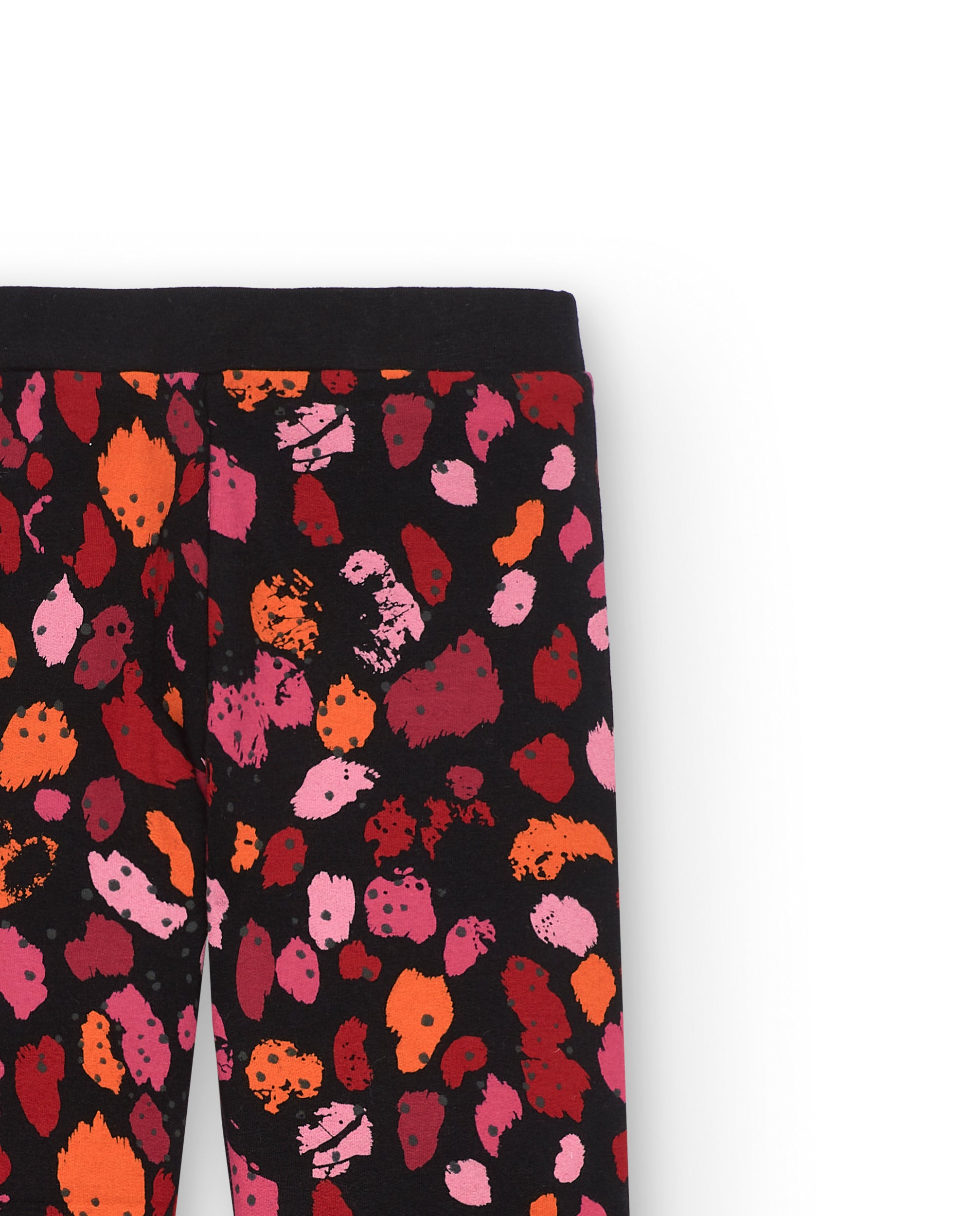 Leggings negros con estampado de manchas en tonos rojos y rosas