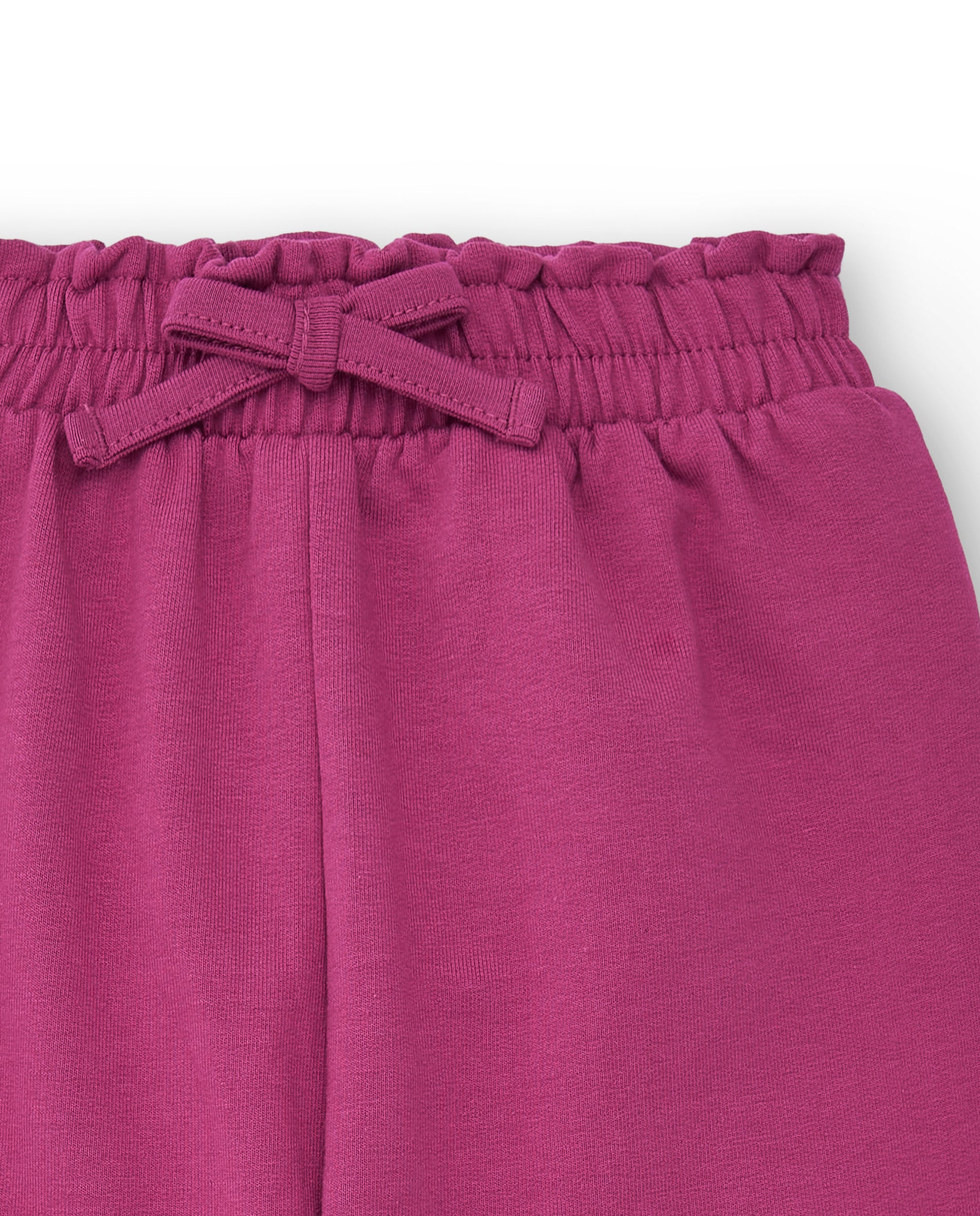 Pantalón de felpa para niña en color fucsia con lazo colección
