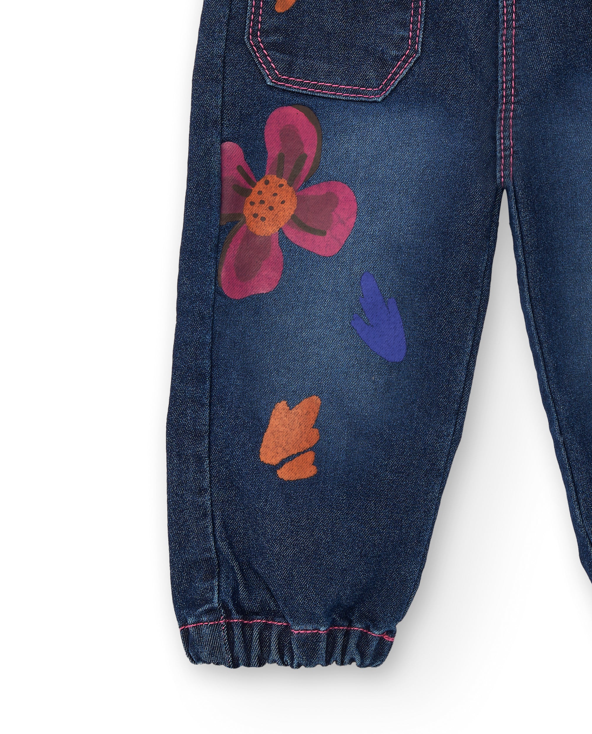 Pantalón vaquero para niña en azul con estampado floral