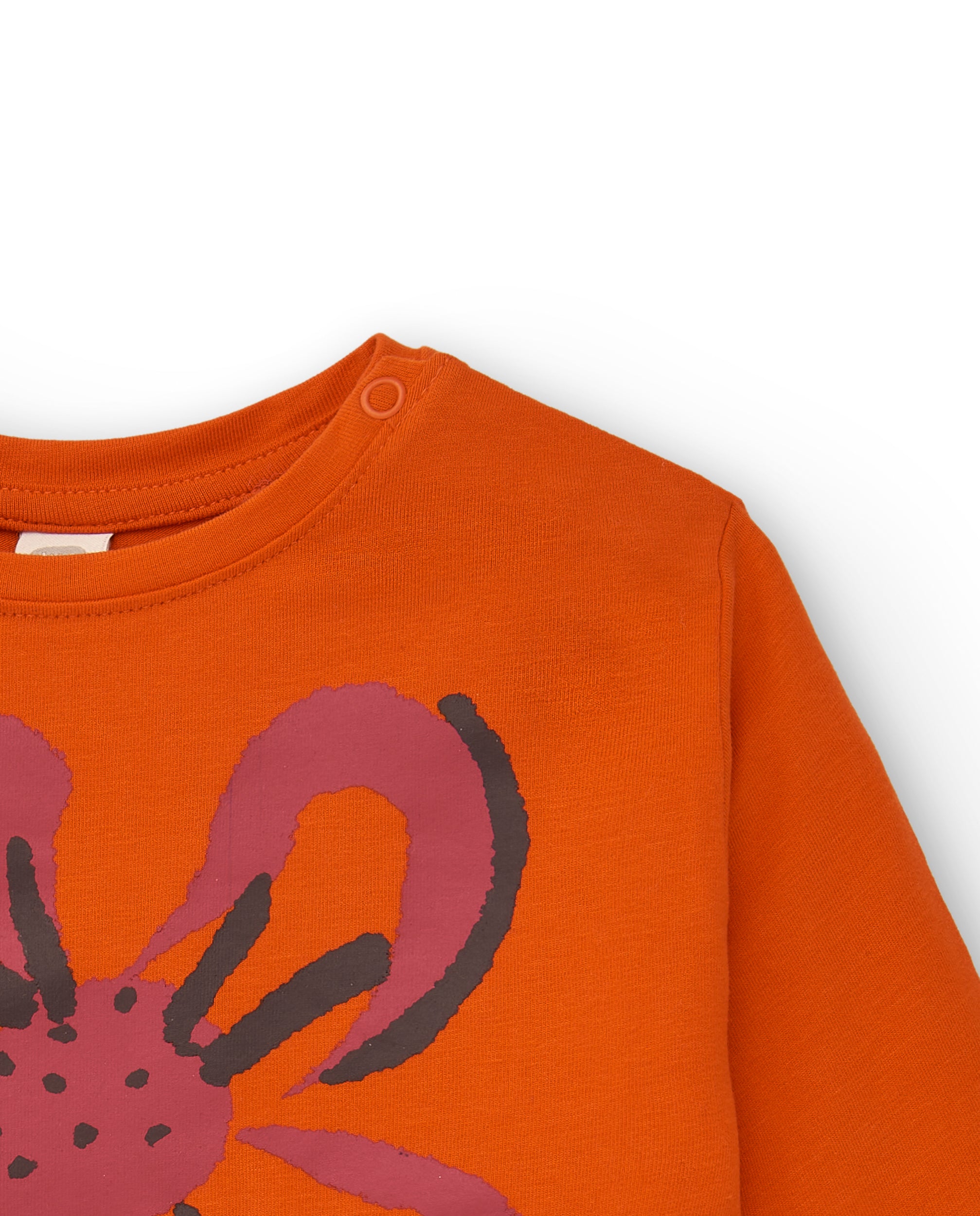 Camiseta de niña en naranja con estampado floral y texto