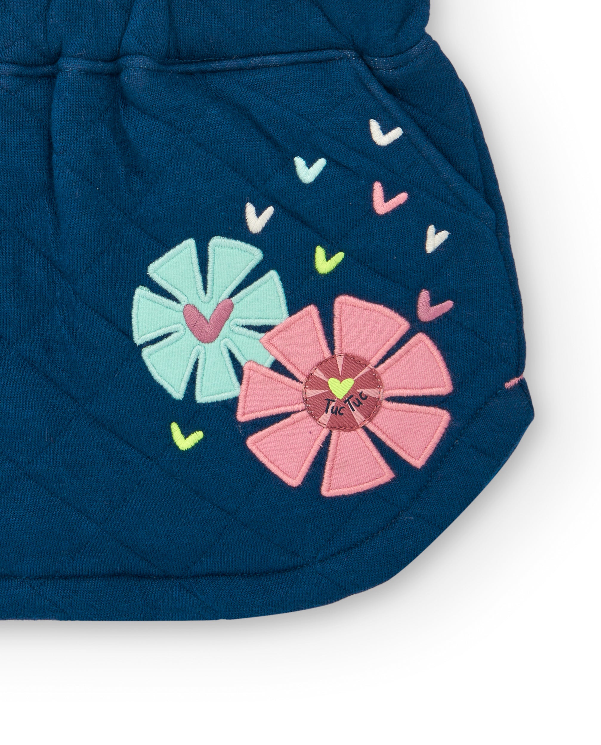 Falda acolchada azul con detalles de flores para niña de la