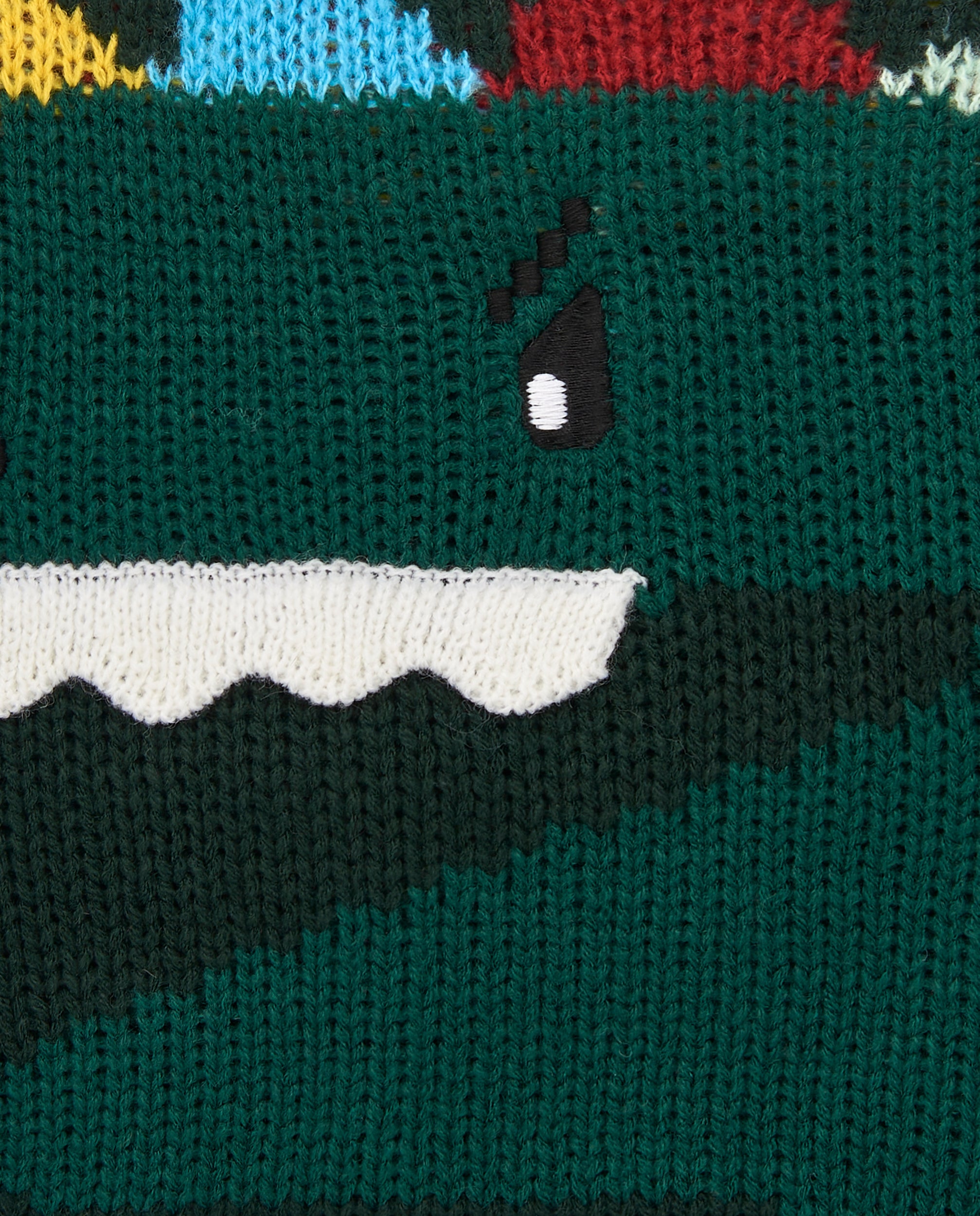 Suéter tejido para niño en verde con diseño de dinosaurio en
