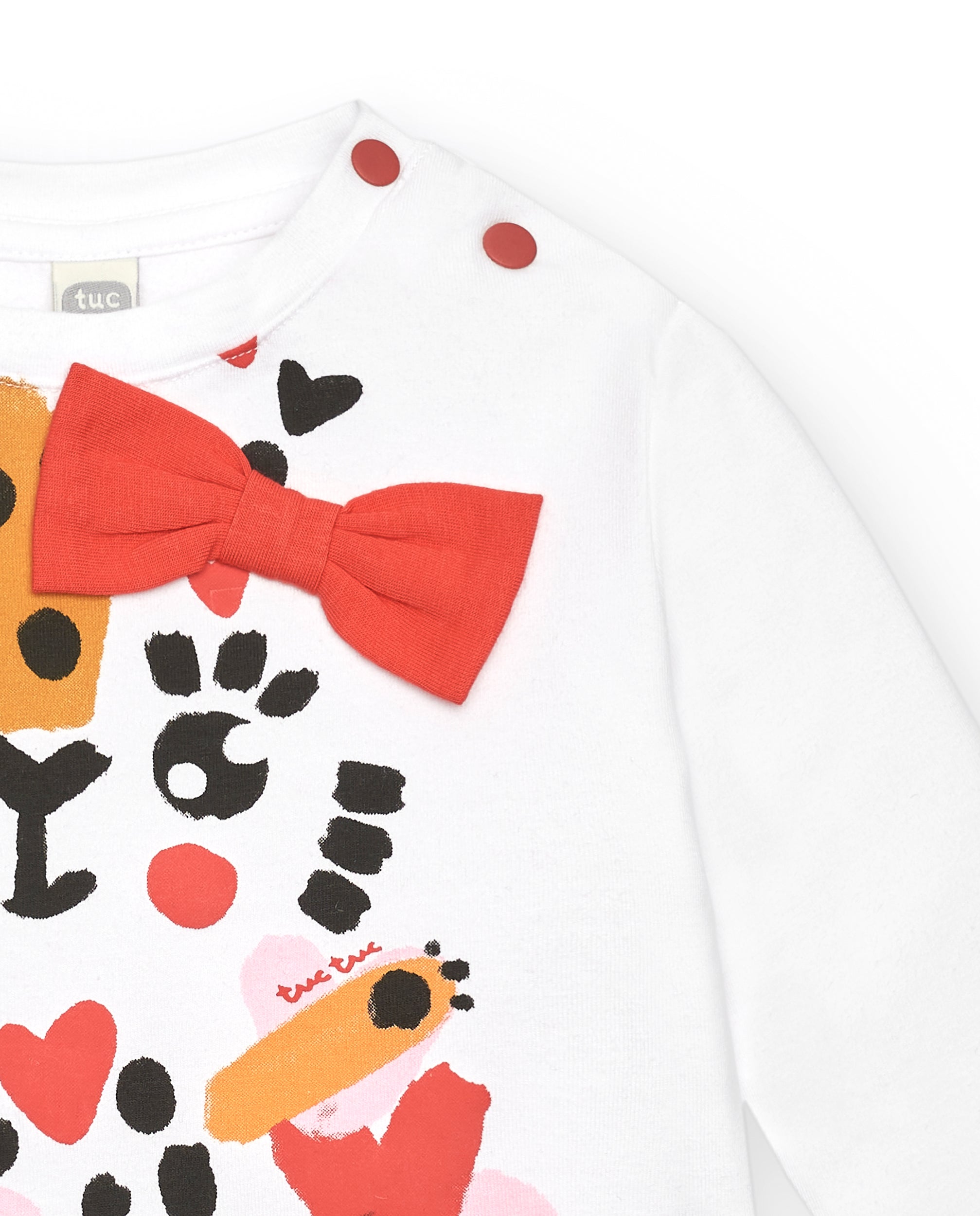 Camiseta niña en blanco con estampado de leopardo y lazo rojo