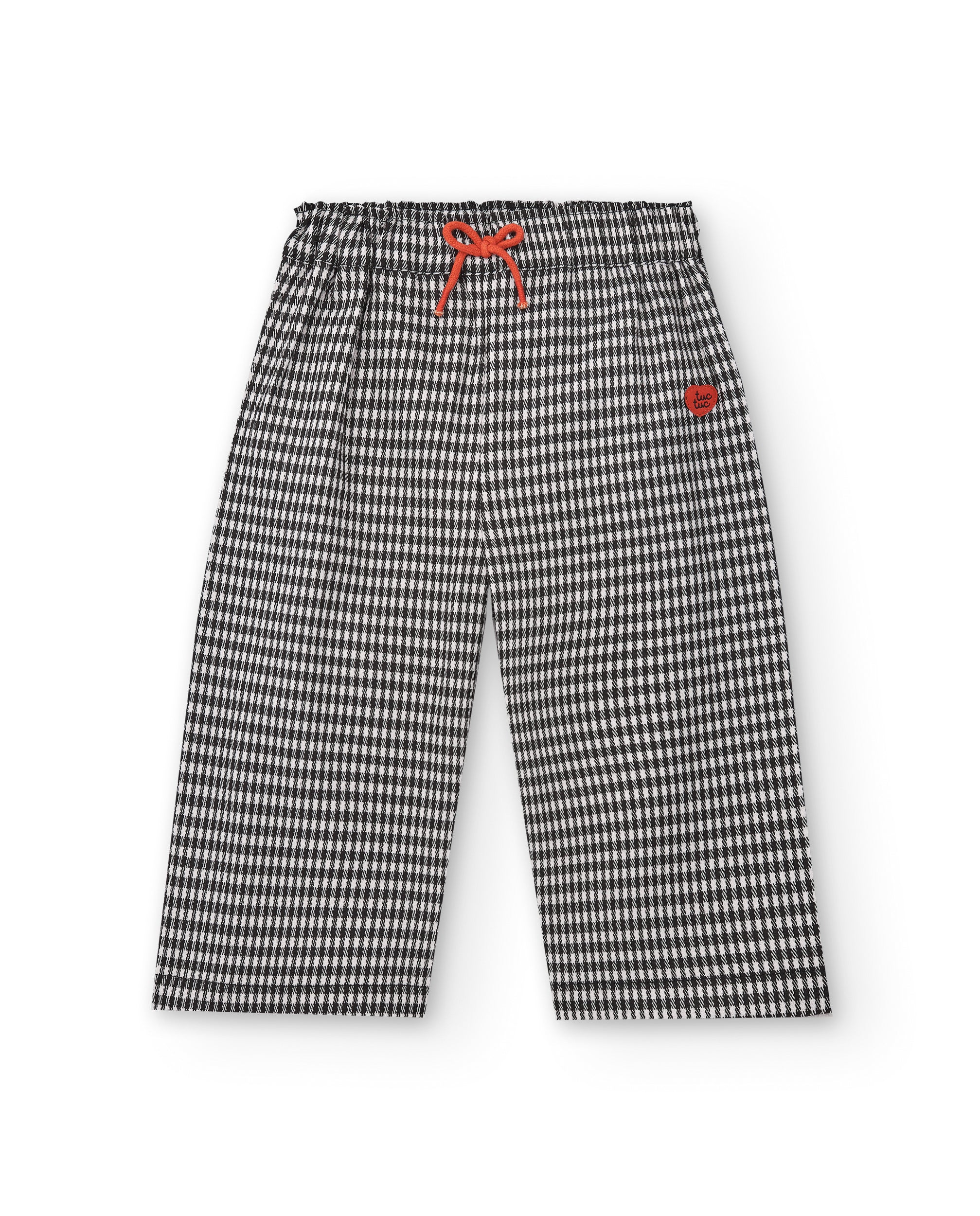 Pantalón de cuadros vichy en blanco y negro con lazo rojo para