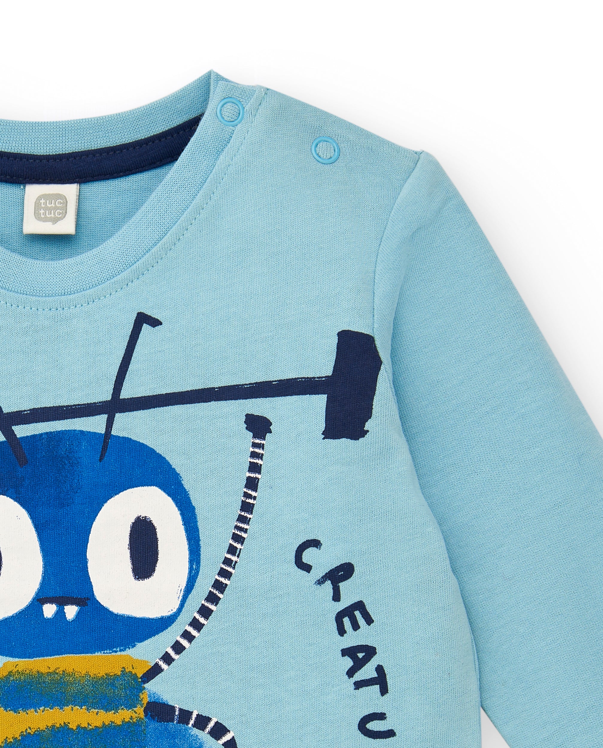 Camiseta punto niño en azul con estampado de criatura y manga