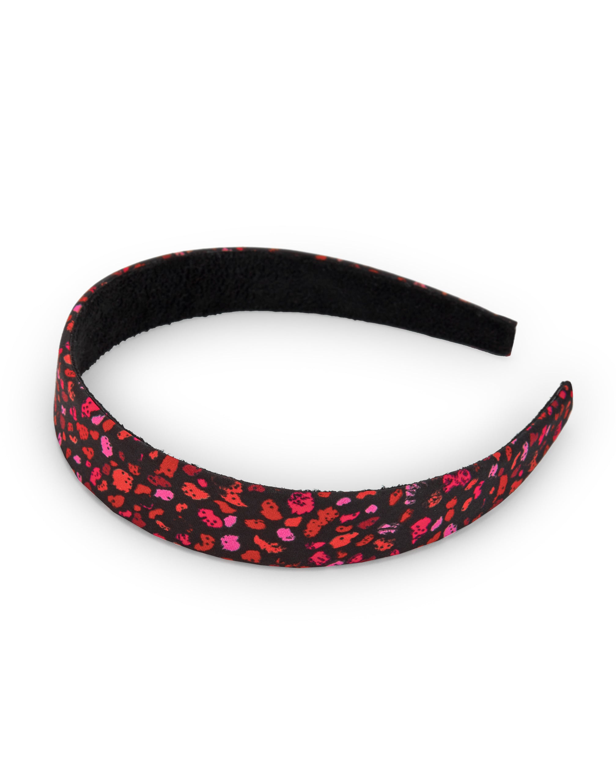 Diadema negra con estampado animal print en tonos rosas y rojos