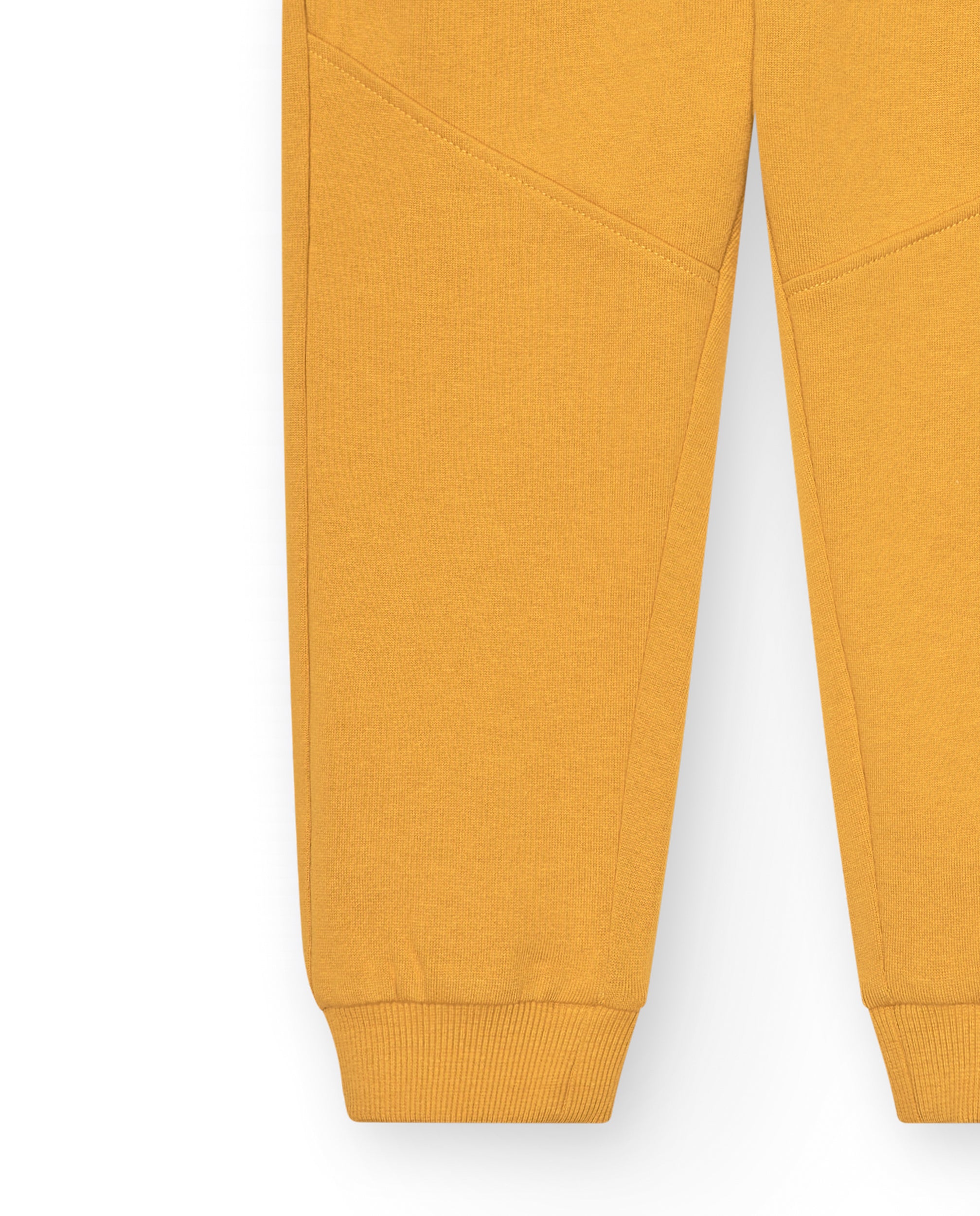 Pantalón jogger mostaza con parches para niño colección Pet