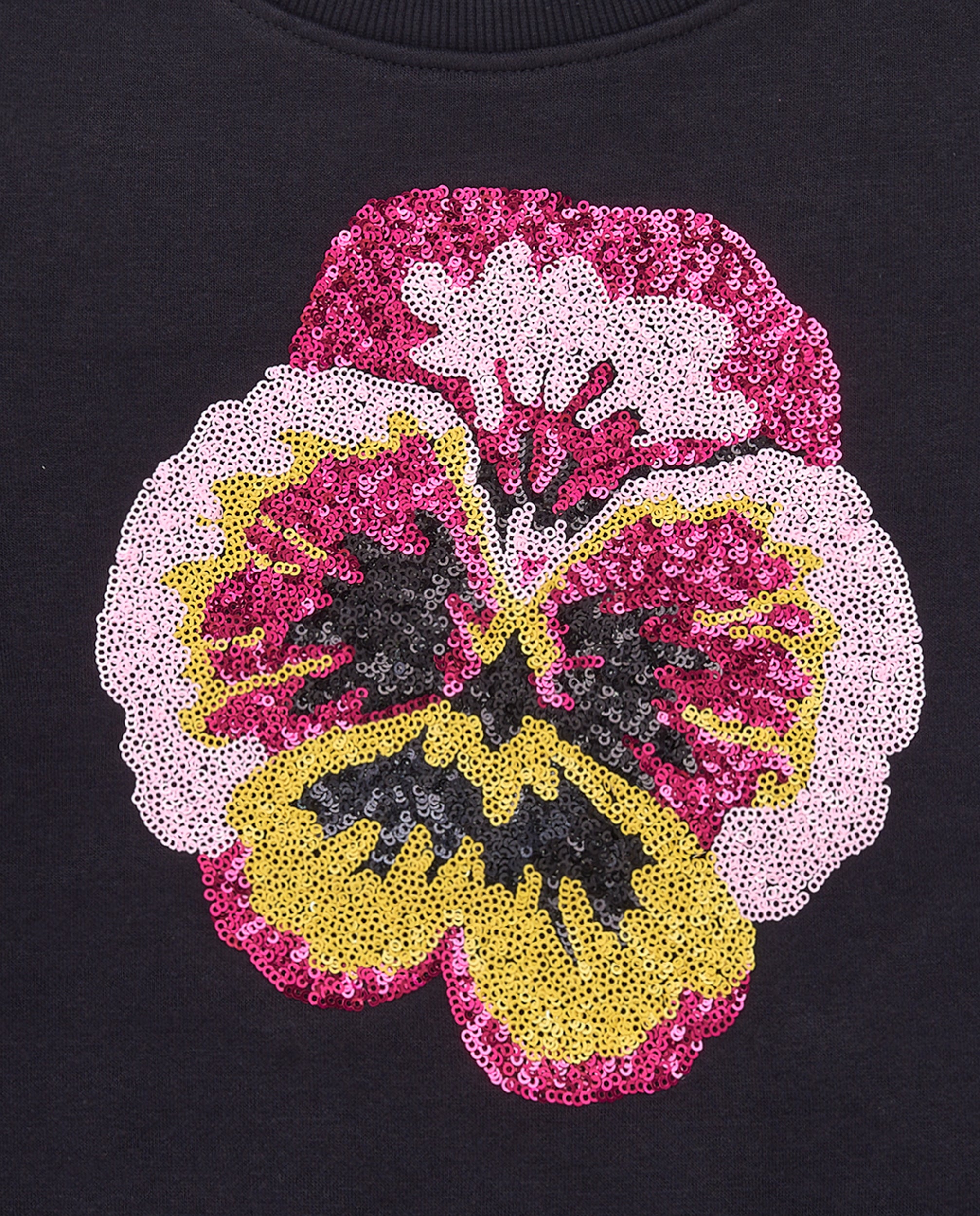 Sudadera negra con flor de lentejuelas para niña colección