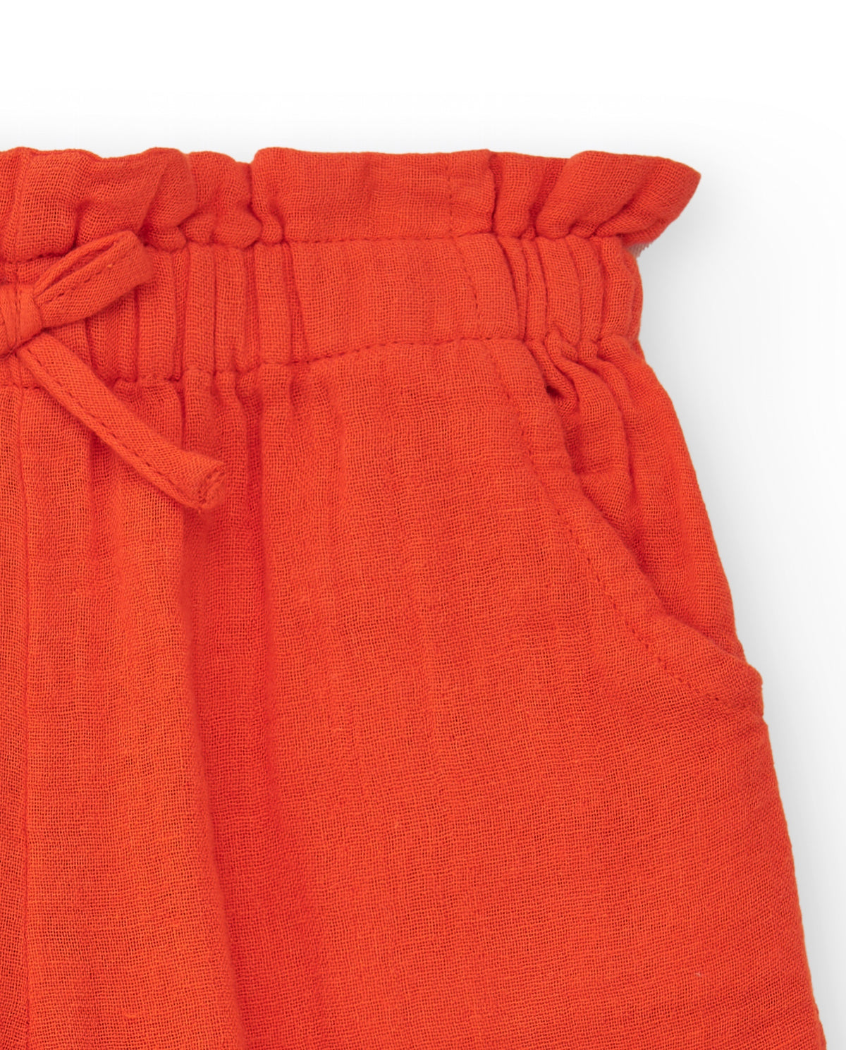 Pantalón culotte naranja para niña con cintura fruncida y lazo