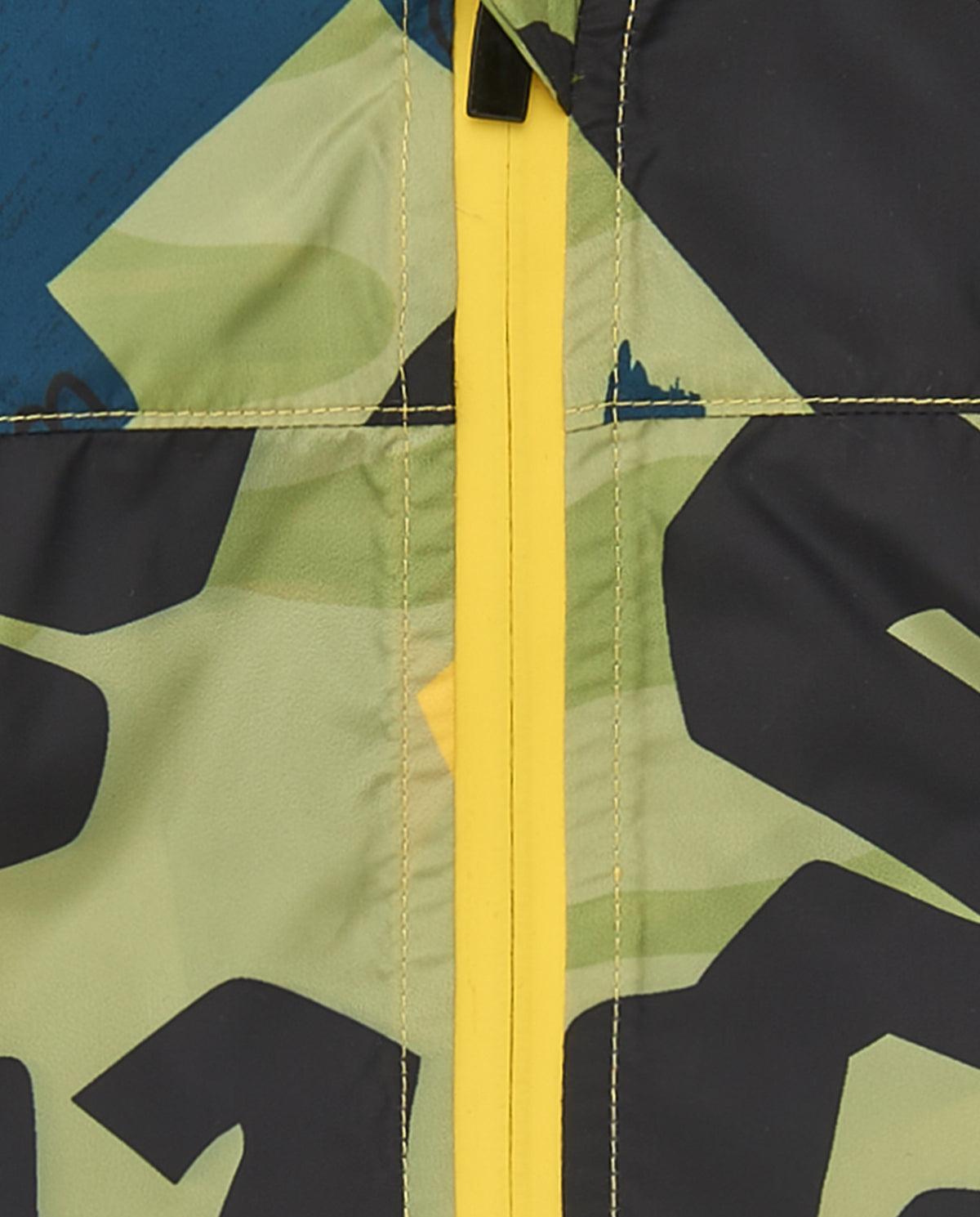 Cortavientos verde para niño con estampado de dinosaurios y