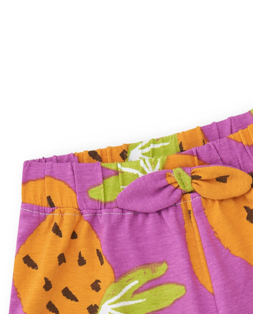 Pantalón corto tropical para niña en morado y naranja con frutas