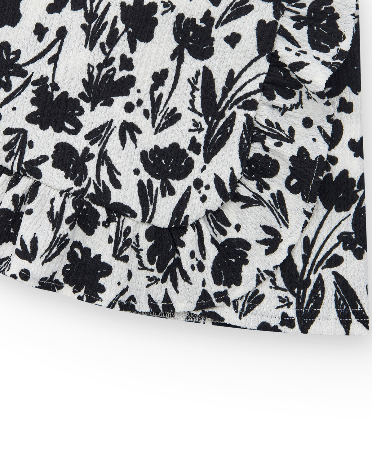 Falda para niña en blanco con estampado floral y volante