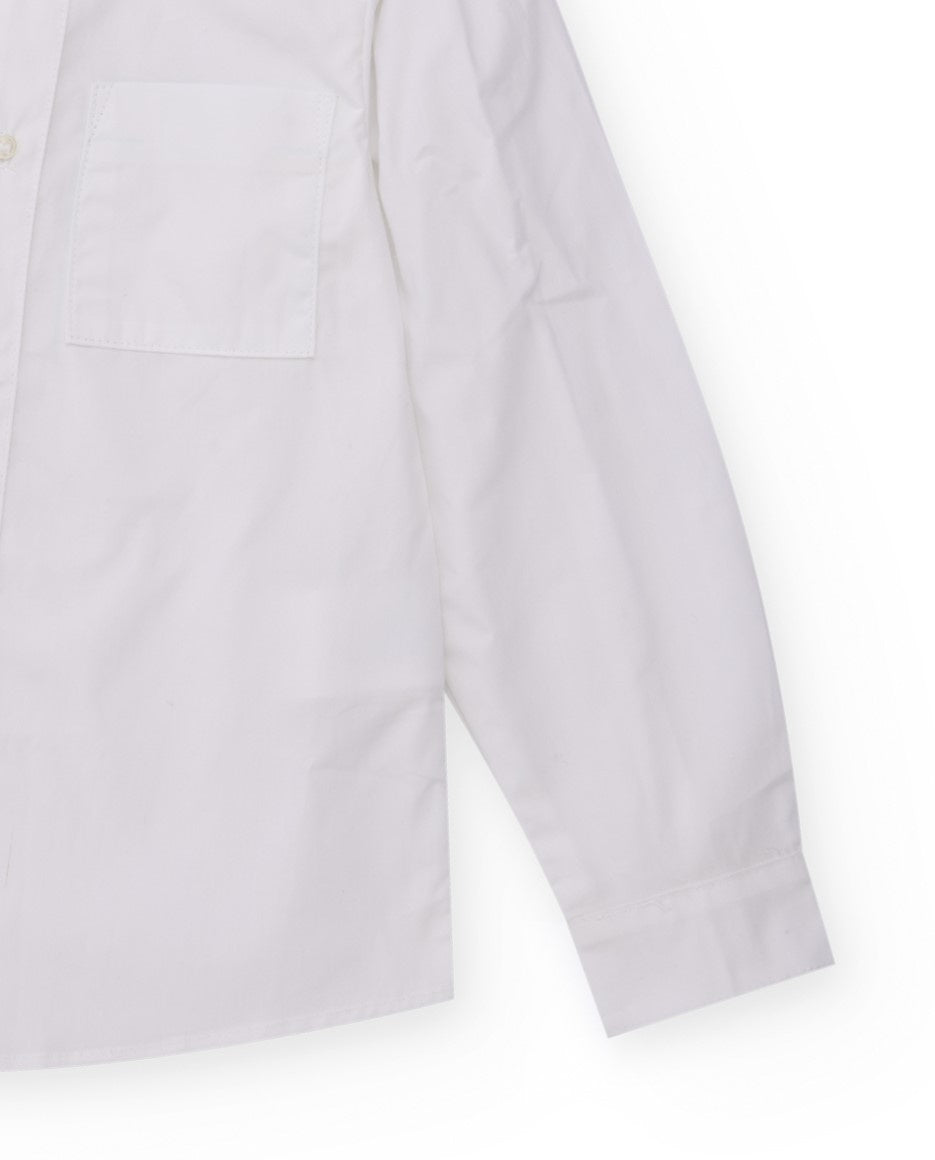 Camisa blanca de manga larga para niño con bolsillo y botón