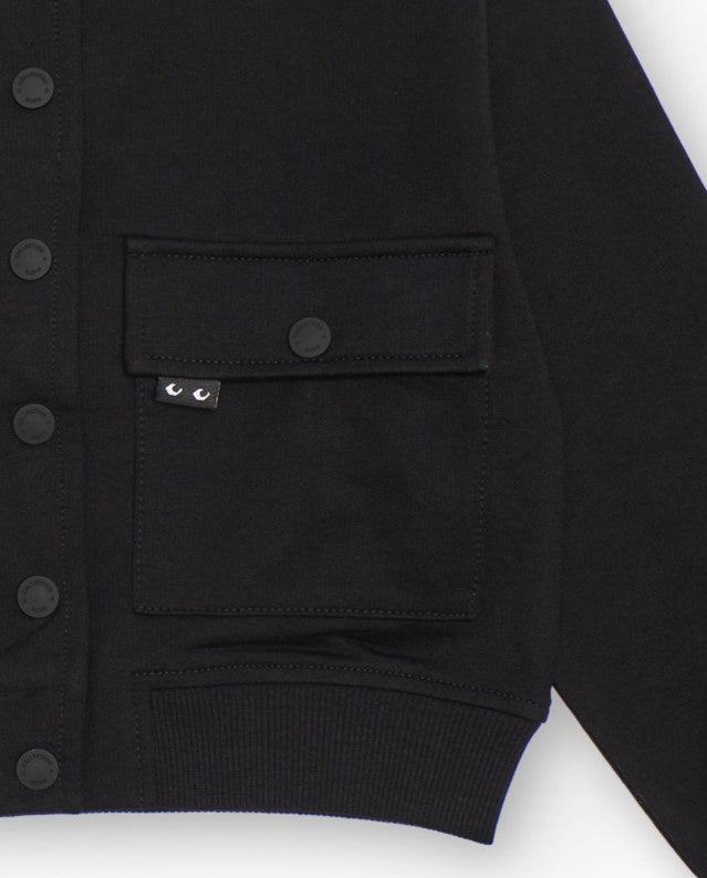 Chaqueta negra de felpa para niña con bolsillos frontales