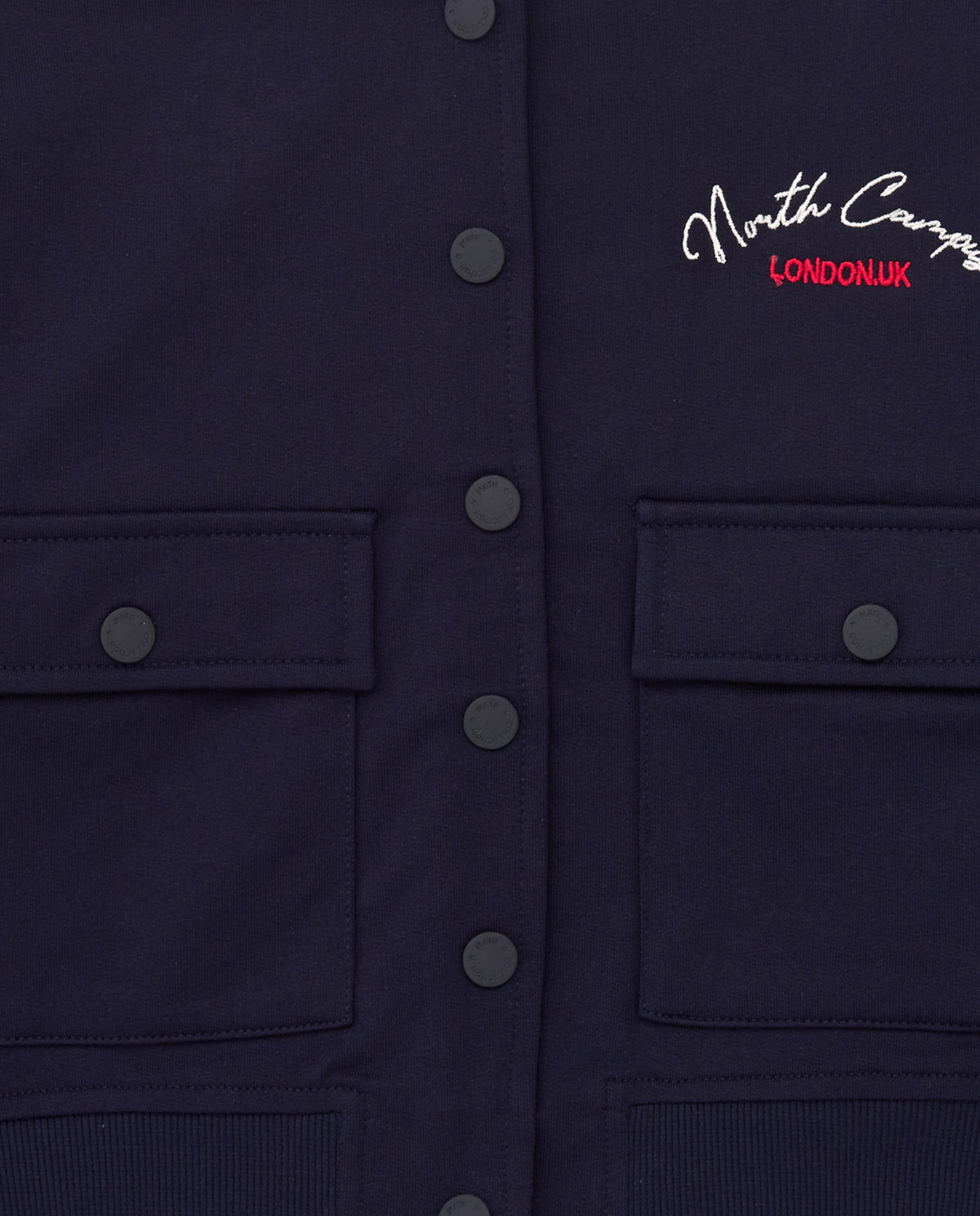 Chaqueta azul marino de felpa para niña con bordado frontal