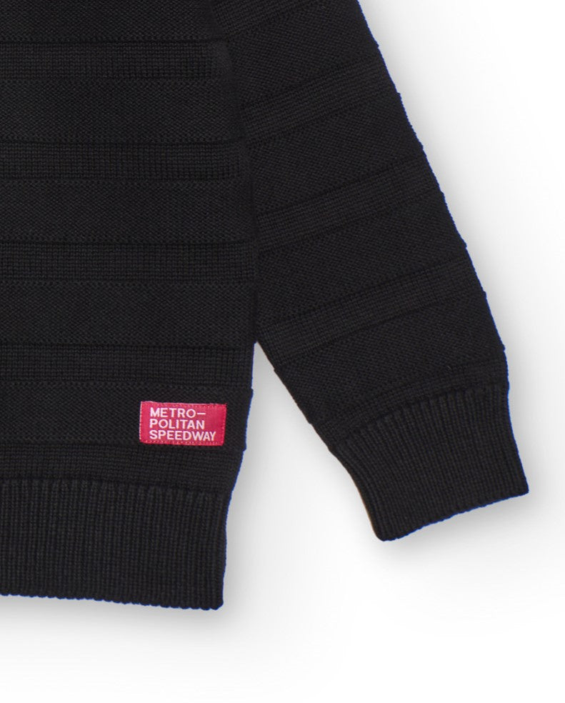 Suéter negro para niño con textura de rayas
