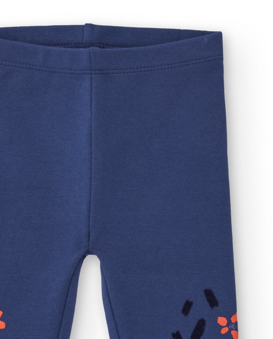 Leggings para niña en color azul marino con estampado de flores.