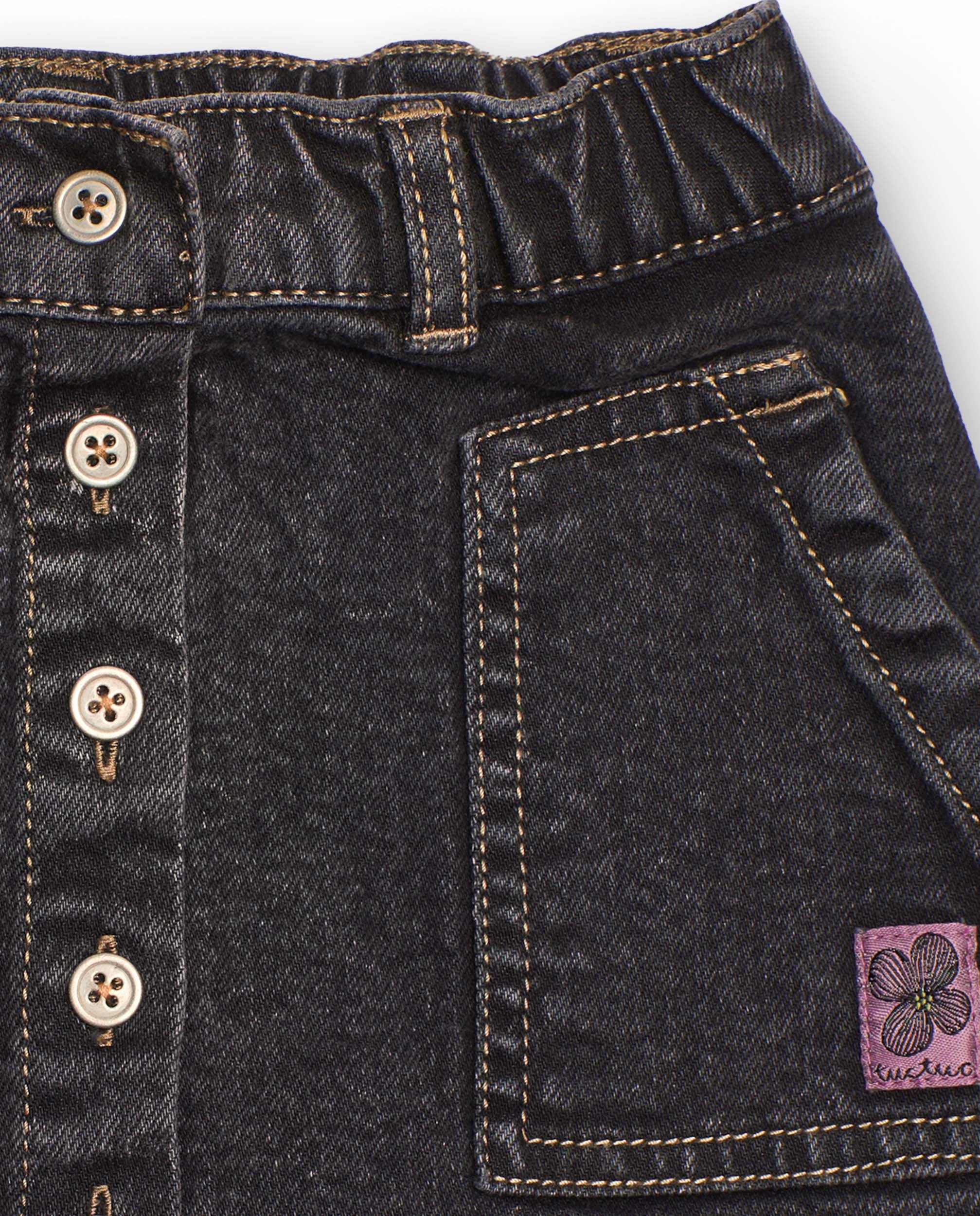 Falda niña en denim negro con bolsillos de parche y botones