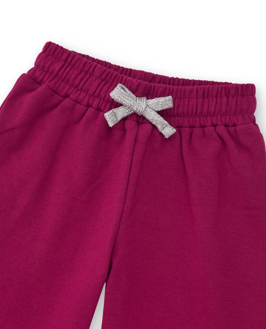 Pantalón ancho de niña en color fucsia con lazo brillante