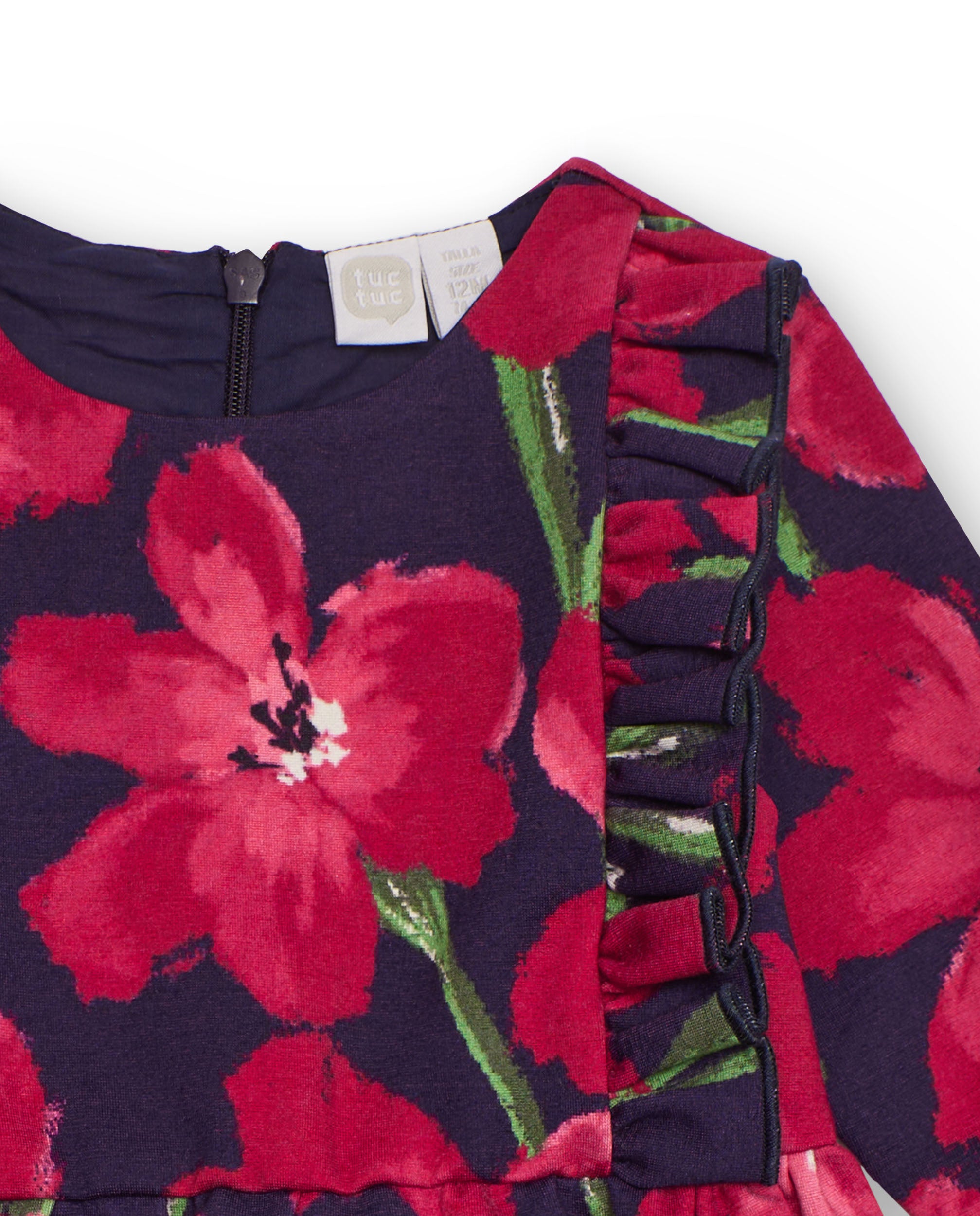 Vestido de niña con estampado floral rojo sobre fondo azul