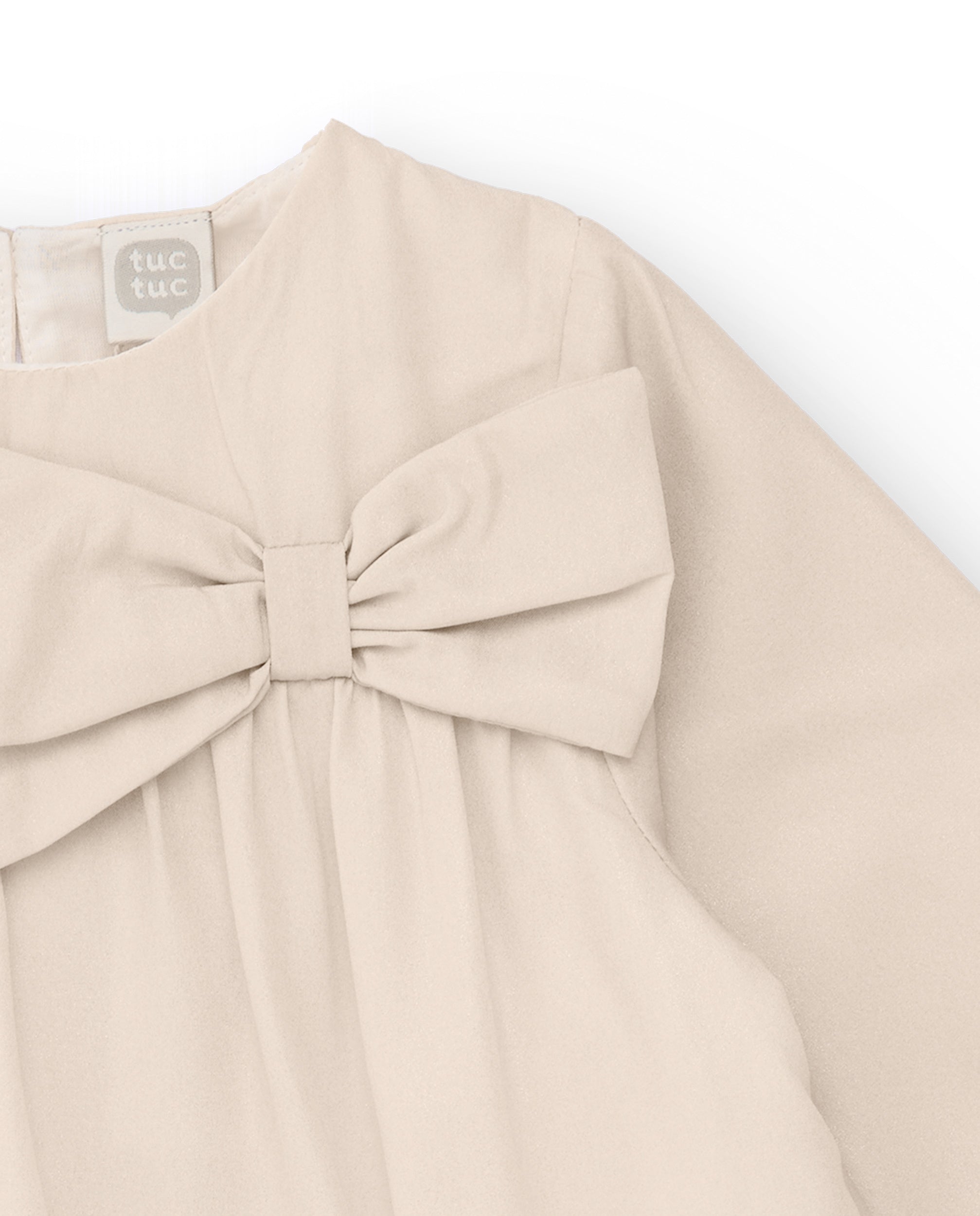 Vestido de niña en beige con lazo decorativo
