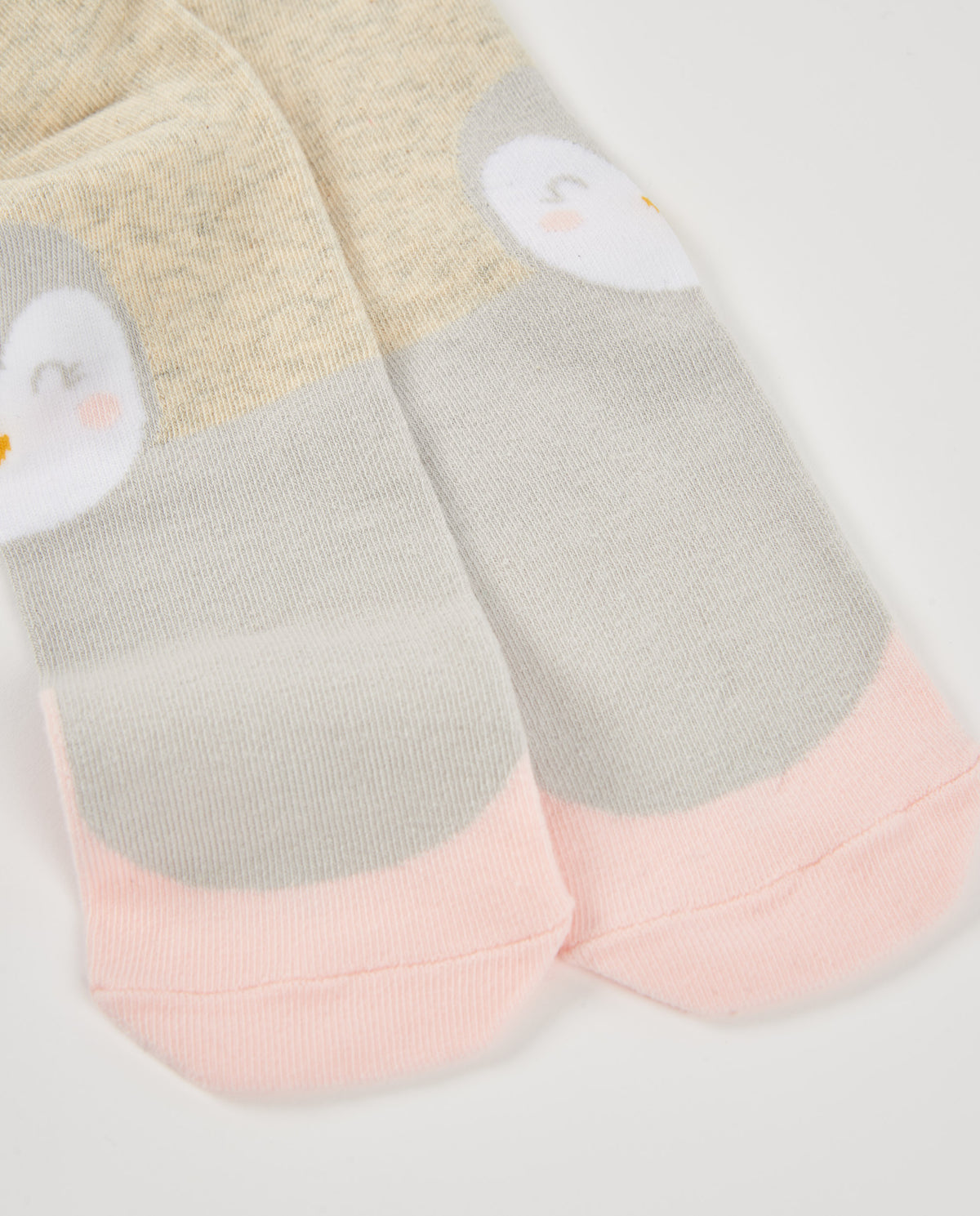 Leotardo de recién nacido en beige con diseño de pingüino