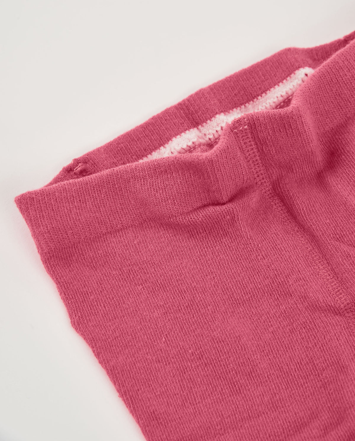 Leotardo para recién nacido en tonos rosa con diseño de
