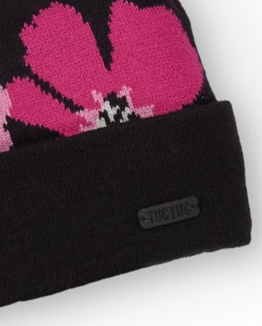 Gorro de niña negro con estampado floral y pompón rosa