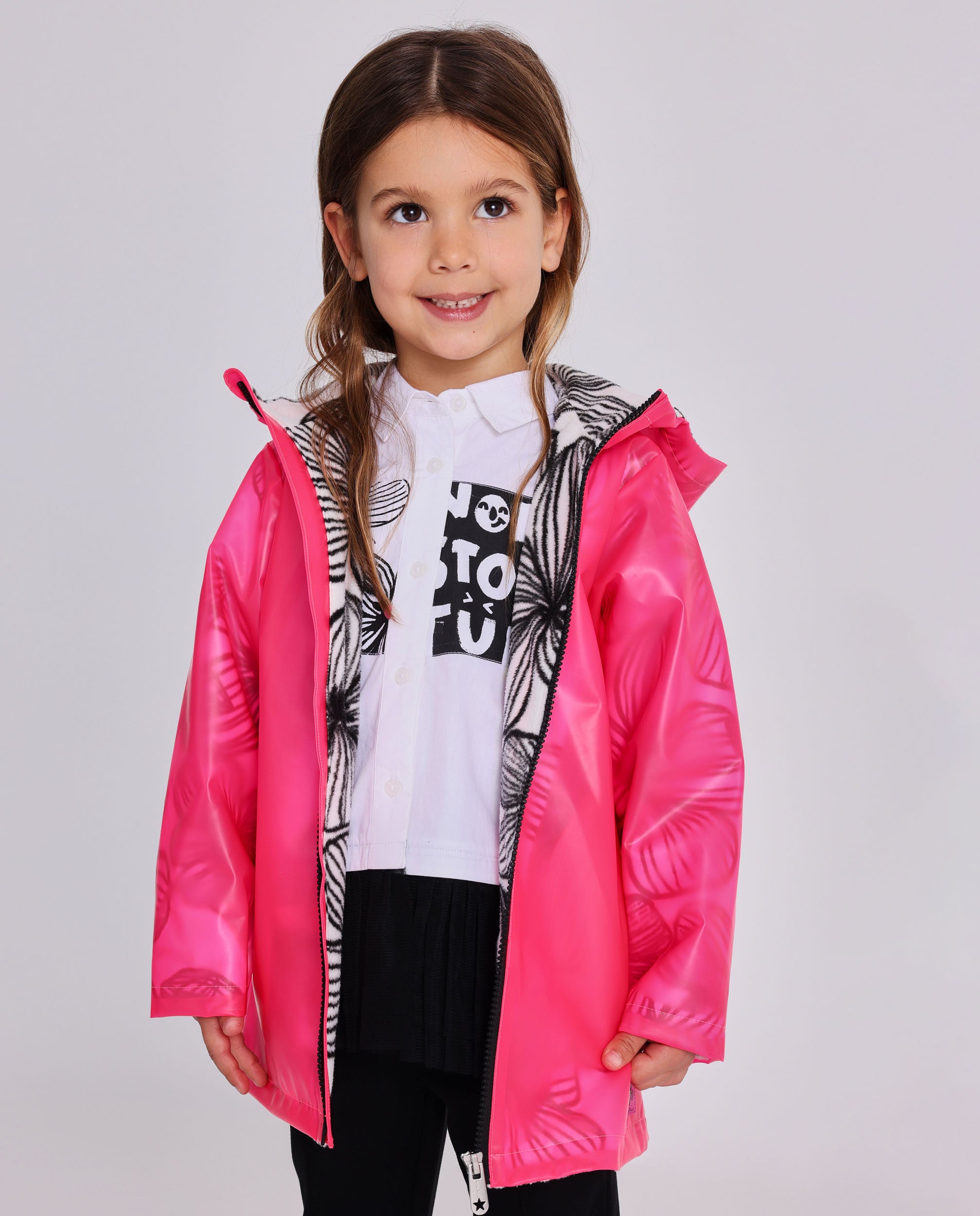 Cazadora niña en fucsia con efecto translúcido y capucha