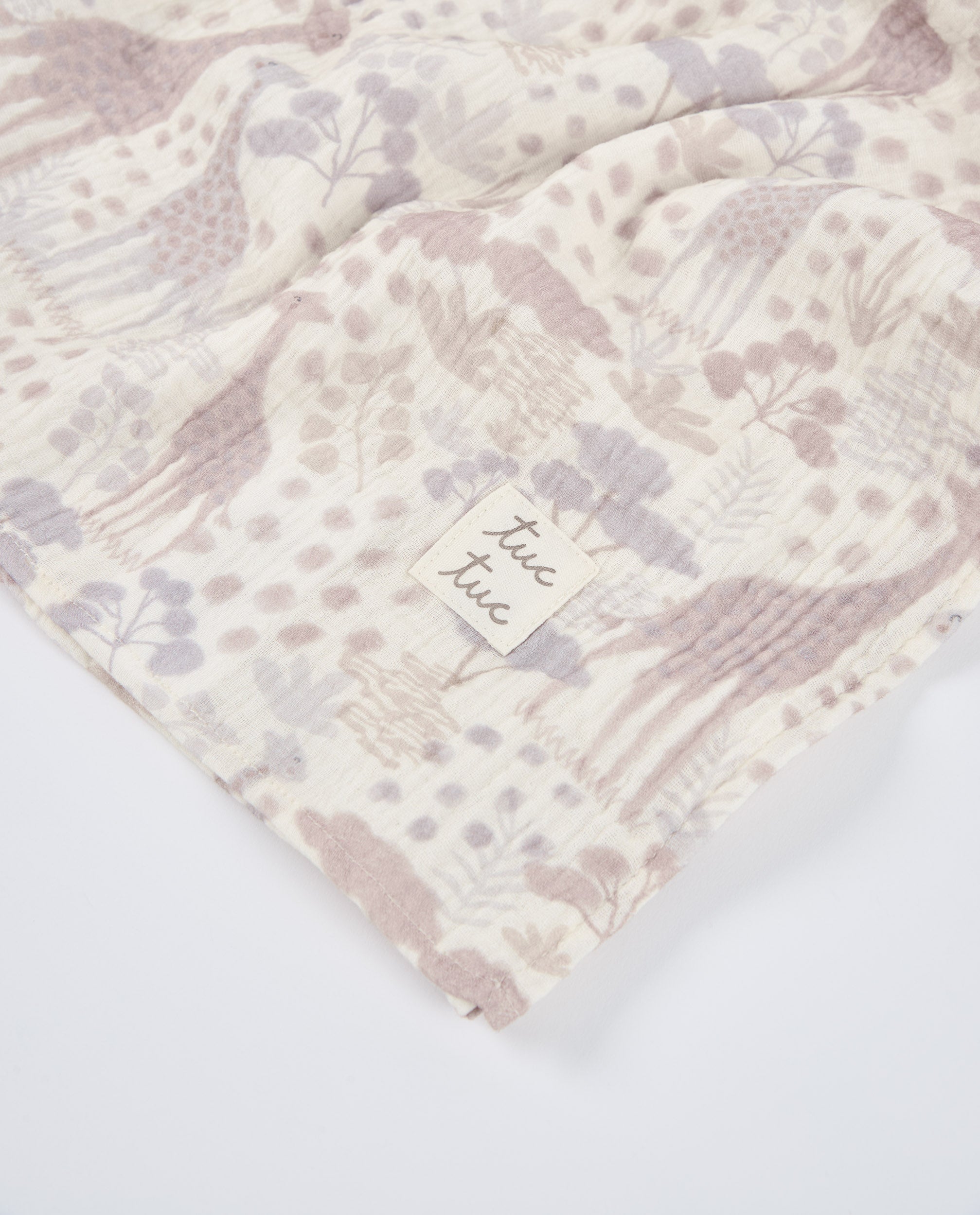 Muselina de bebé con estampado de jirafas en tonos neutros