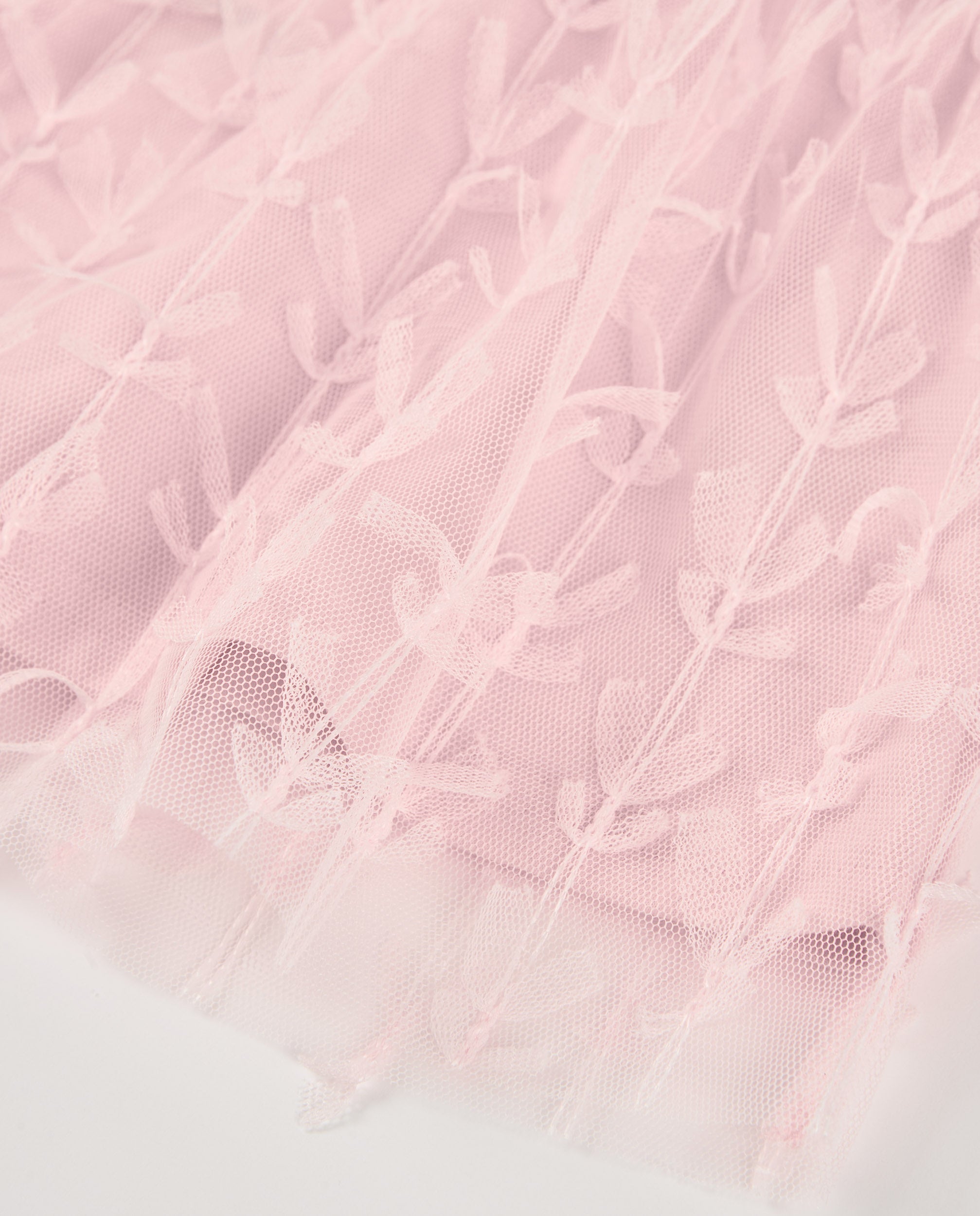 Blusa de niña en tul rosa con mangas abullonadas