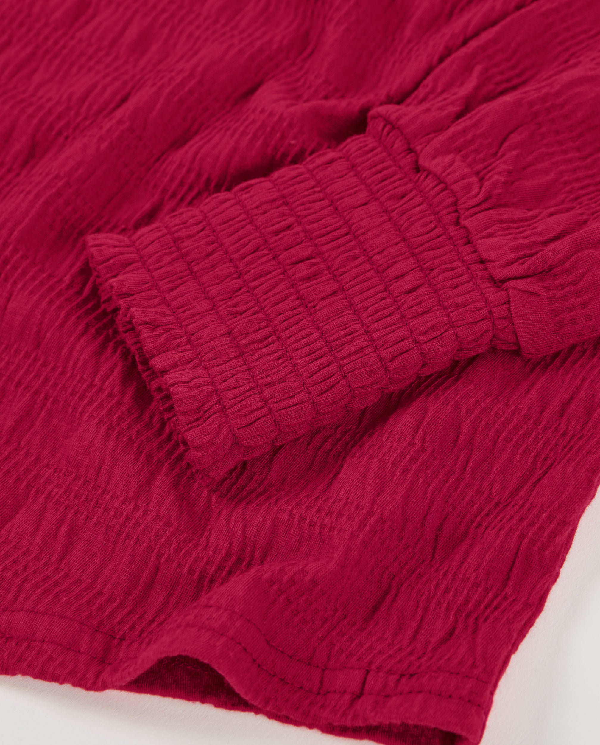 Camiseta de niña en color rojo con mangas largas abullonadas