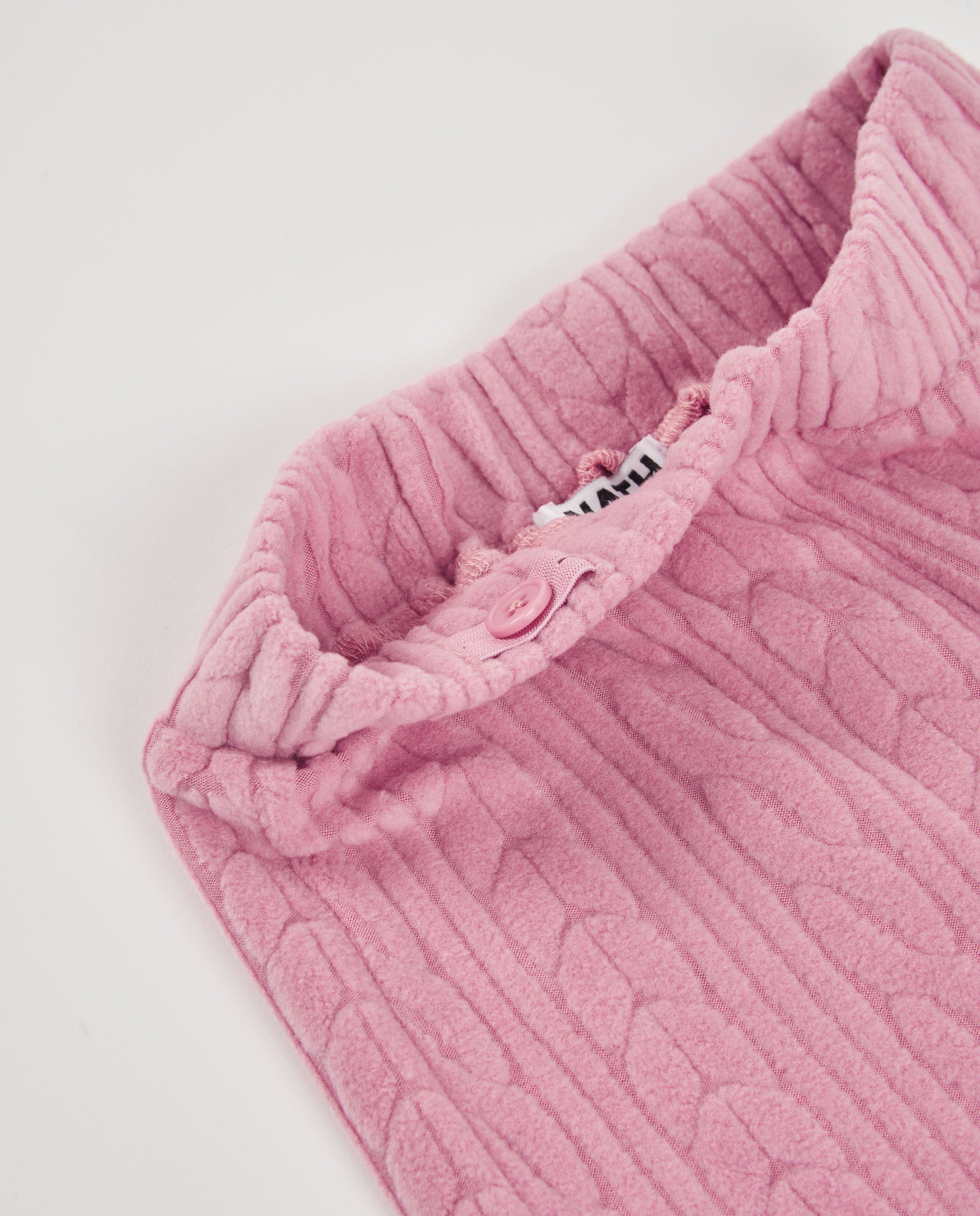 Pantalón largo de niña en rosa con punto trenzado y cintura