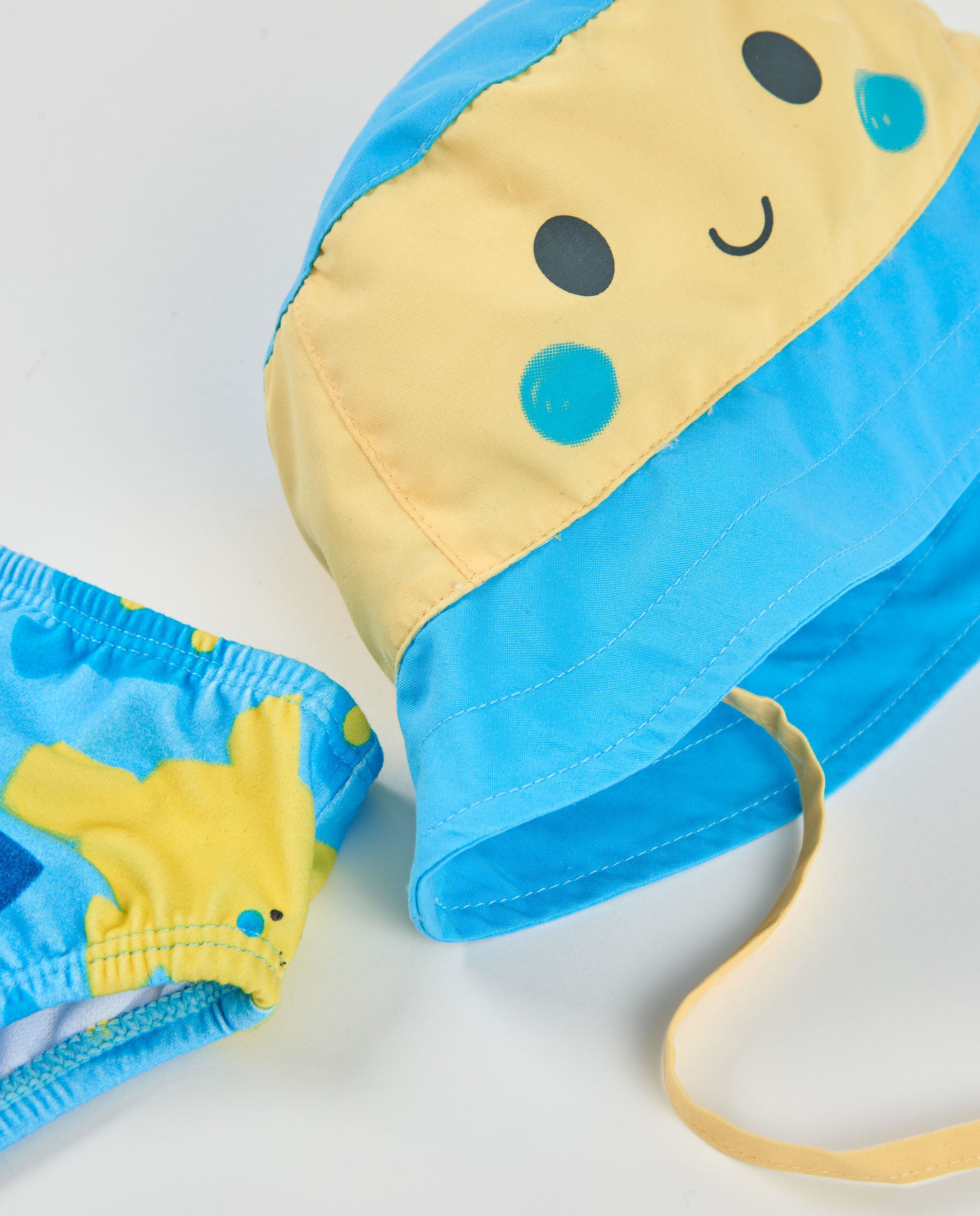 Bañador de recién nacido de plana y diseño de carita sonriente