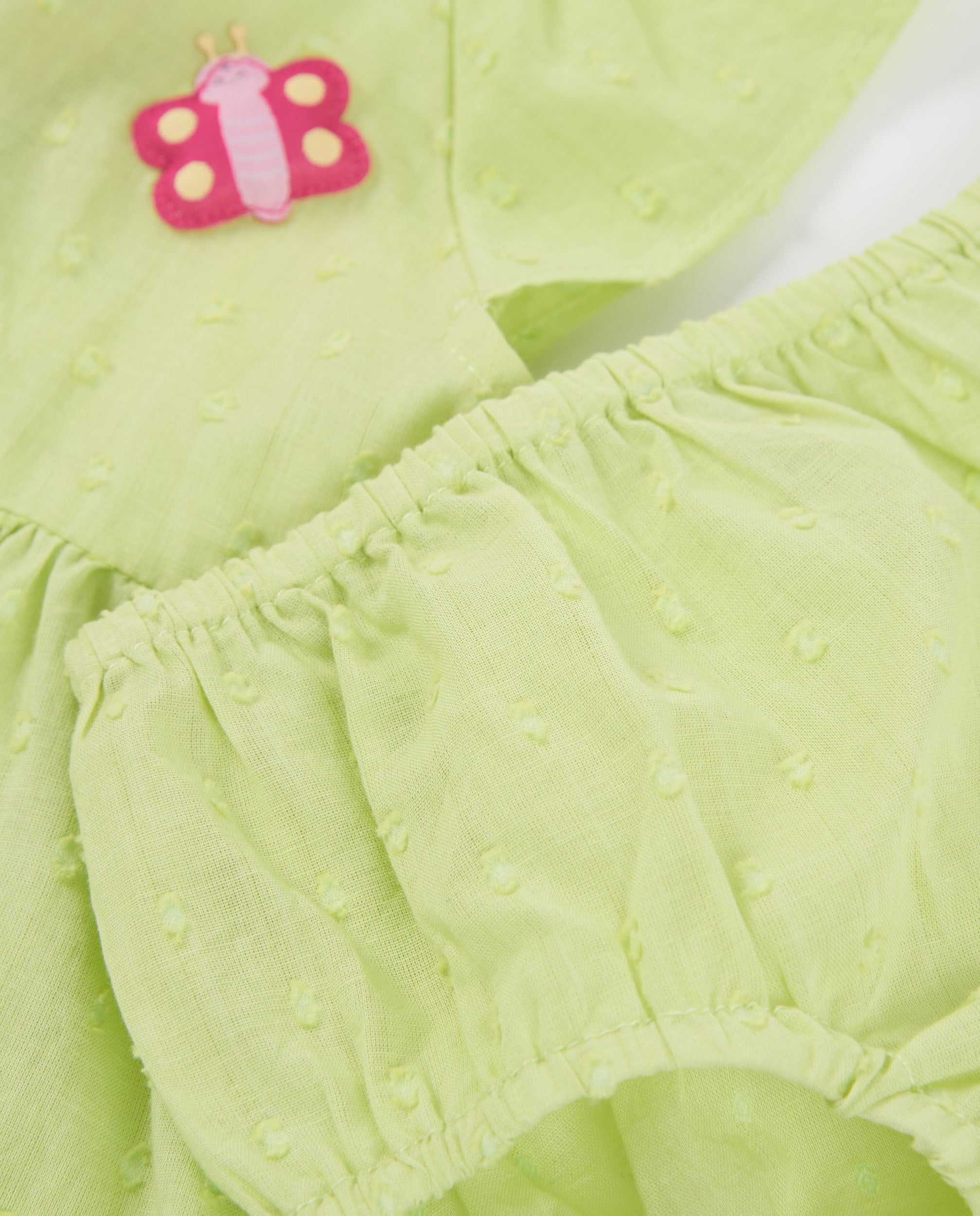 Vestido de recién nacido de plana y textura de topitos