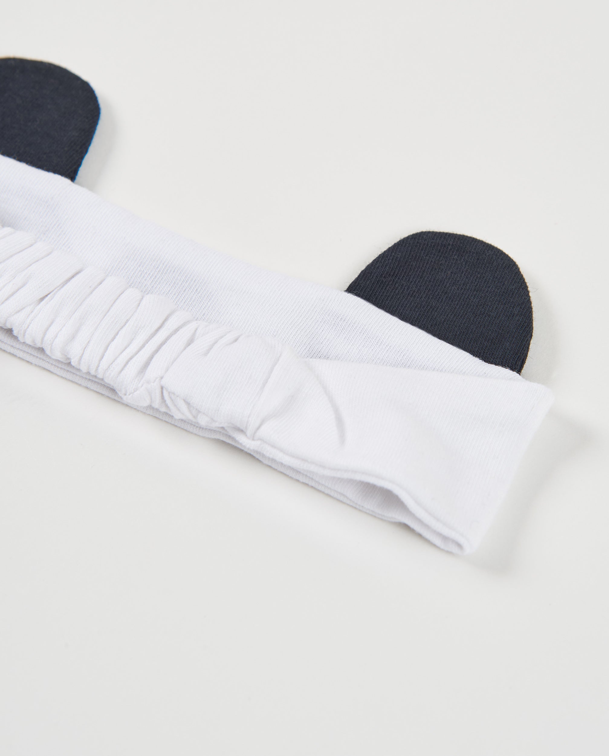 Diadema de recién nacido de punto y apliques en relieve