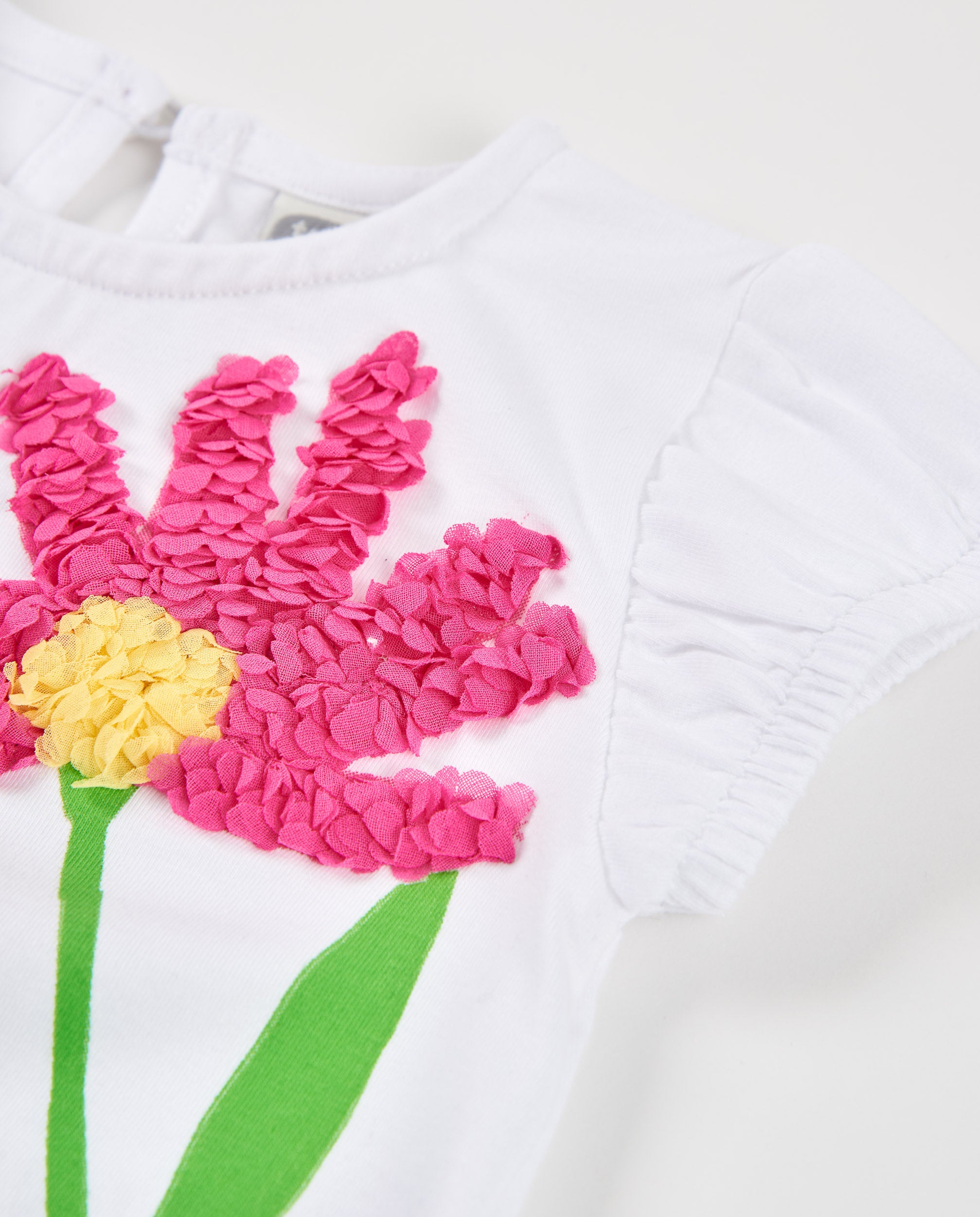 Camiseta de niña de punto y flor en relieve